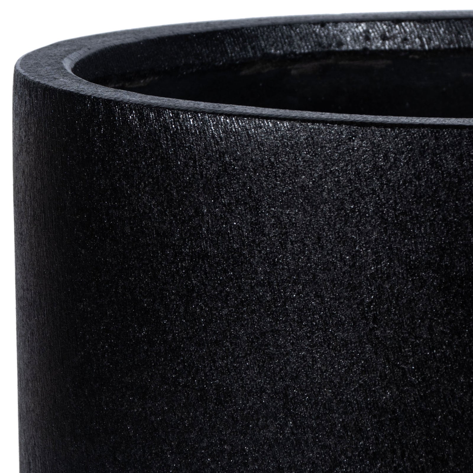 Fine stone-like texture and a softly rounded lip define the black planter || PAT1516A || detail_studio