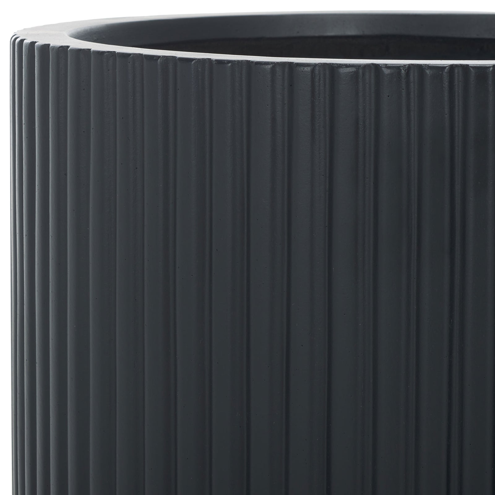A bold black rim frames the deep opening above closely set, sculptural vertical ribs. || PAT1532A-SET2 || detail_studio