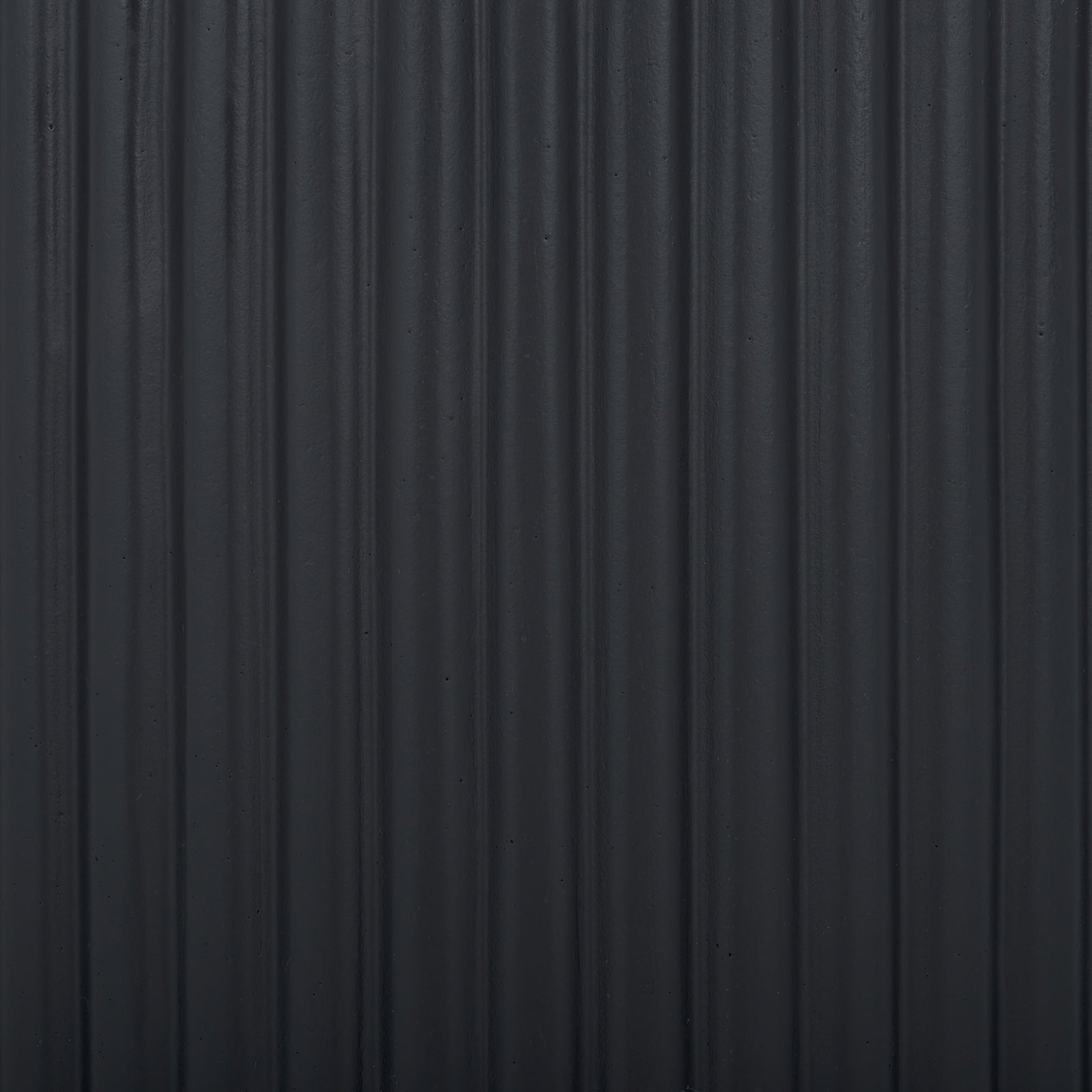 Closely spaced black ribs lend the surface a subtle play of light and shadow. || PAT1532A-SET2 || swatch_studio
