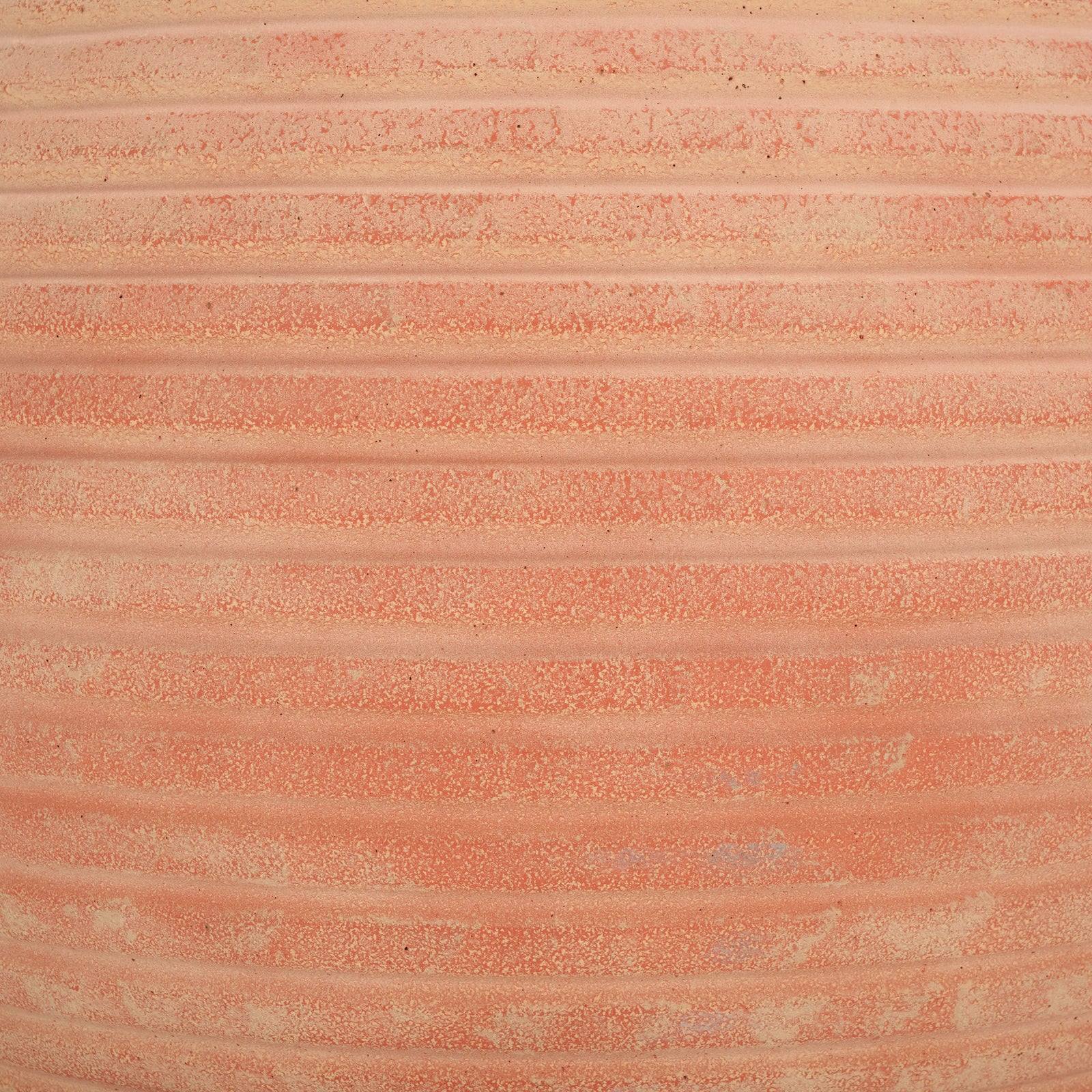 Soft orange and pale clay tones enliven the terracotta planter's raised grooves. || PAT1534D || swatch_studio