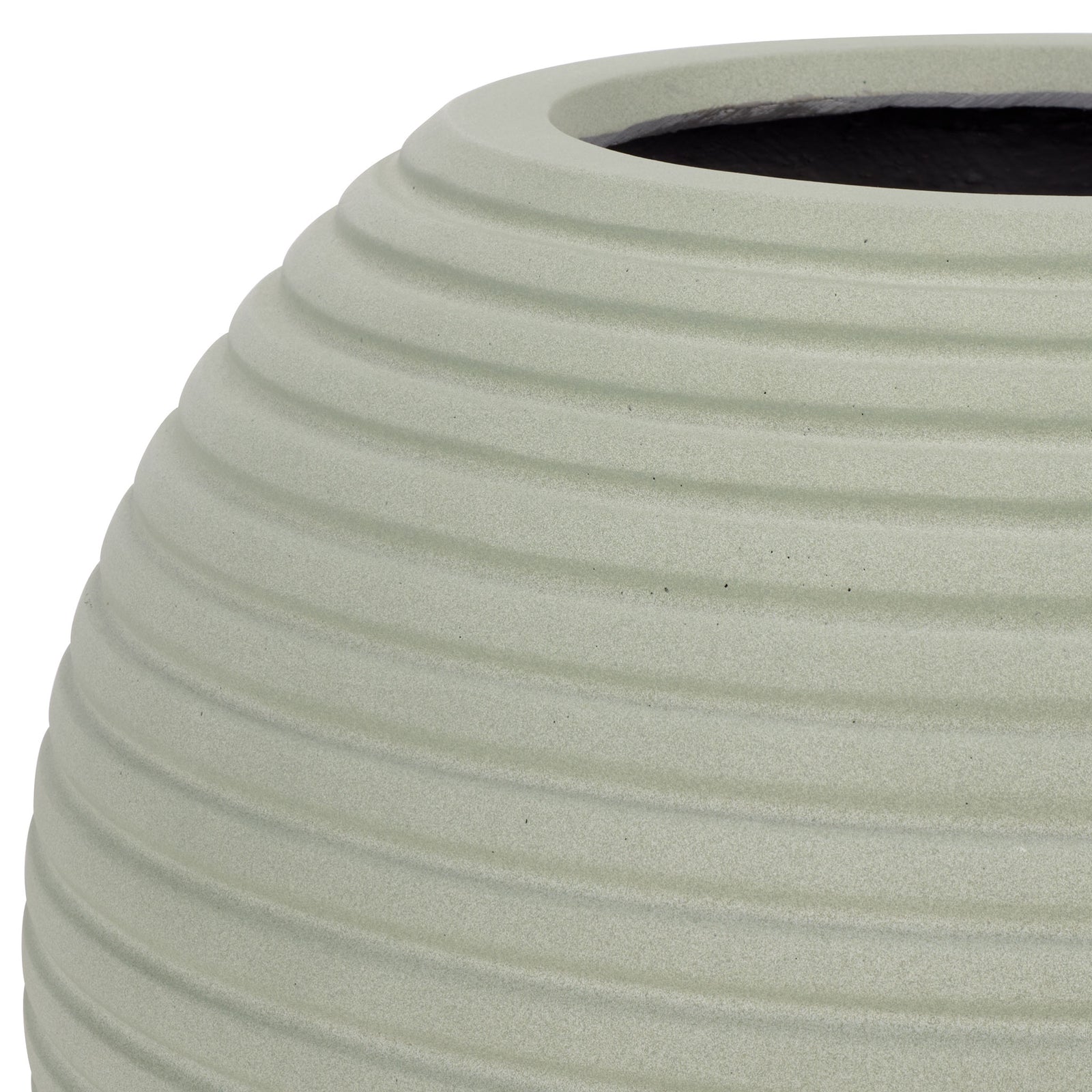 Soft sage finish brings out the rounded lip and sculpted grooves of the planter. || PAT1534E || detail_studio