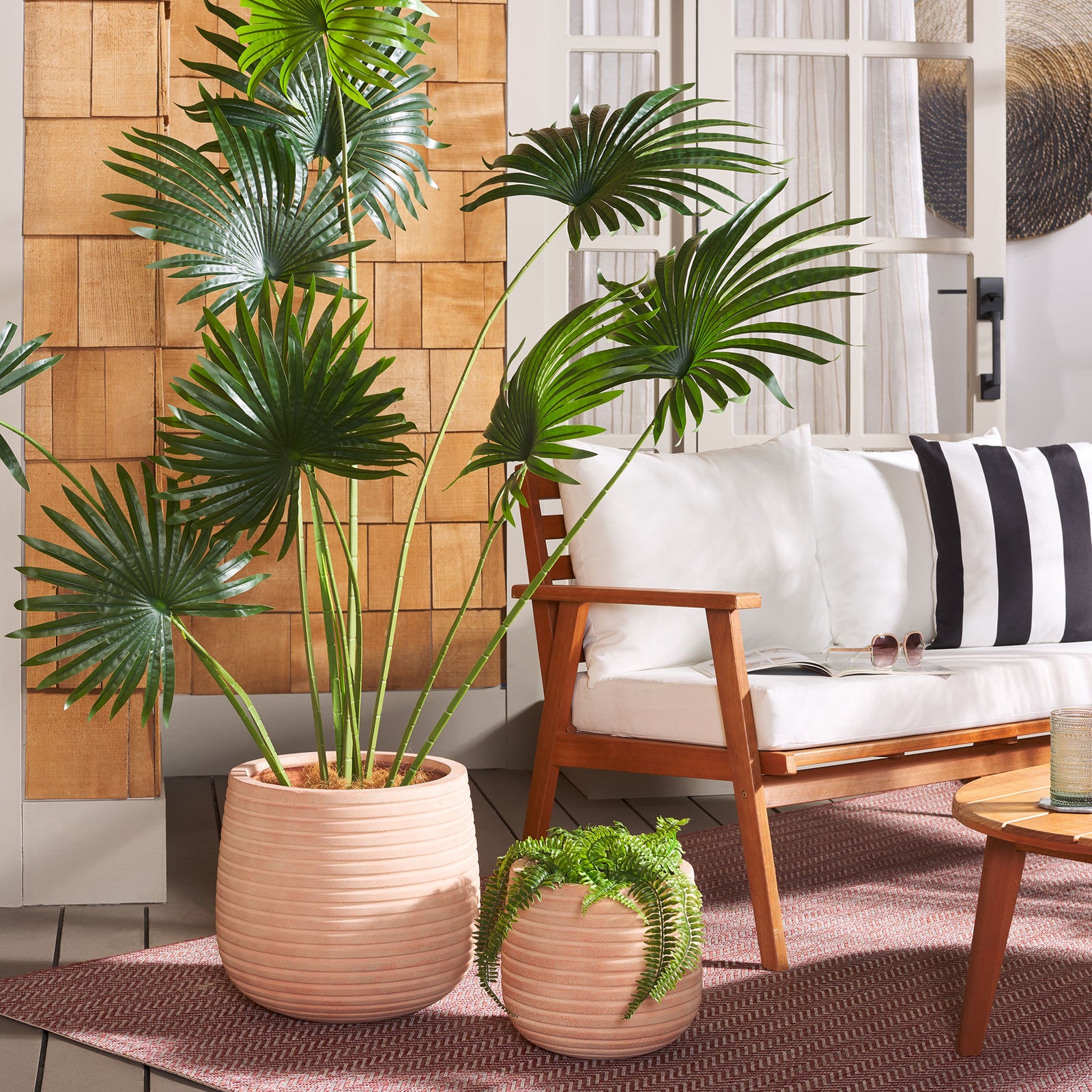 Terracotta planters lend a warm, earthy accent to palms and cascading greenery || PAT1535D-SET2 || front_angle_room