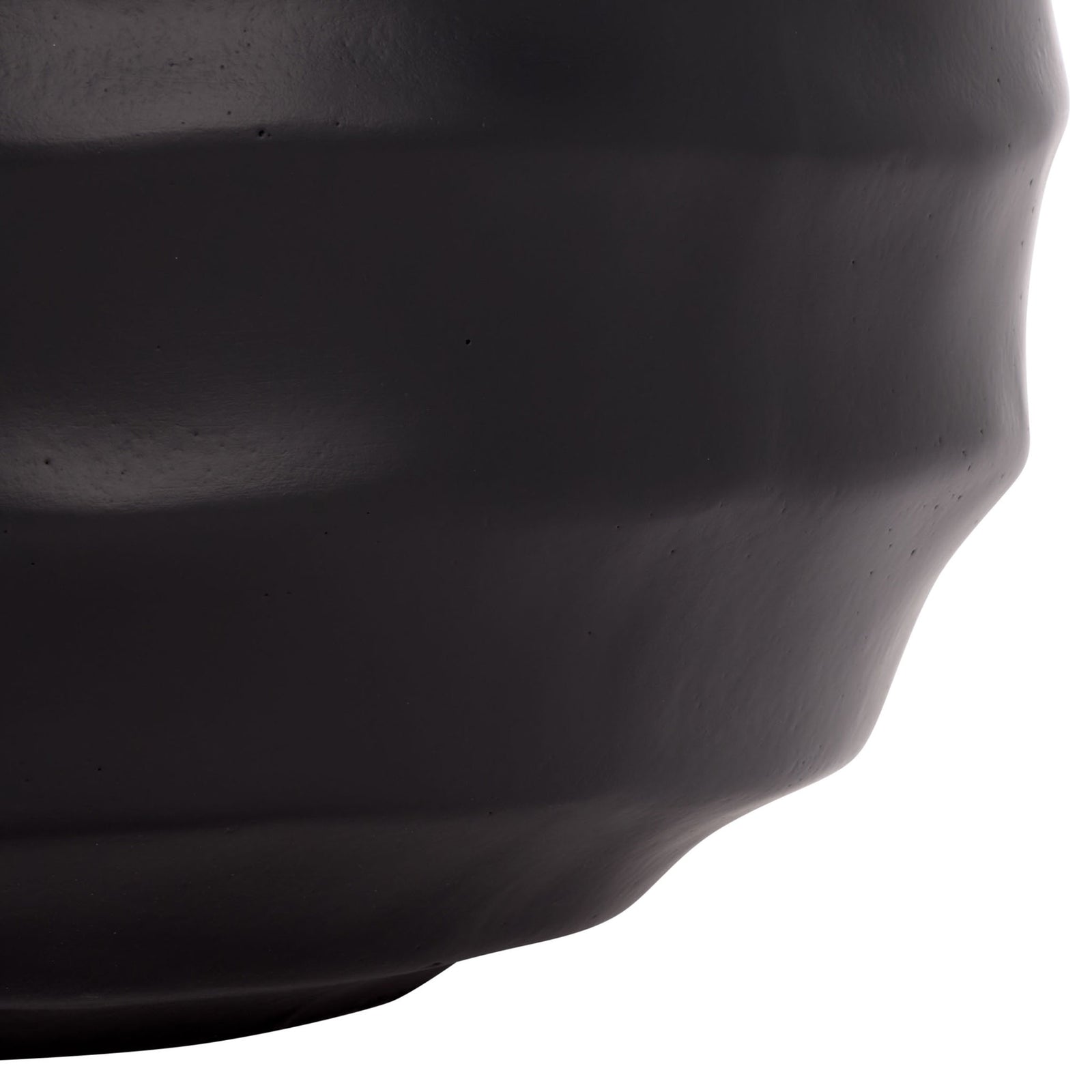 A gently tapered base finishes the black planter's rippled silhouette. || PAT1542A || leg_studio