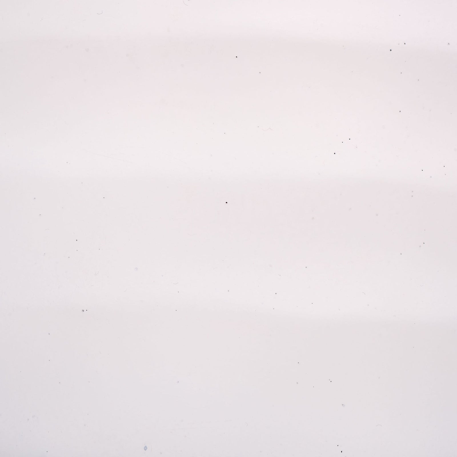 A smooth white finish highlights delicate tonal variation across the planter's surface. || PAT1542C || swatch_studio