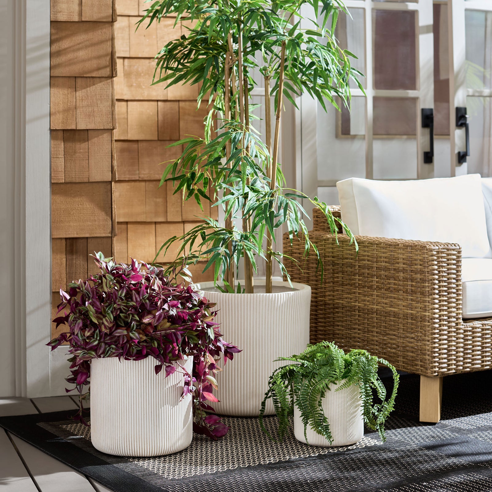 Beige ribbed planters bring layered greenery to a cozy patio seating area. || PAT4600B-SET3 || front_room