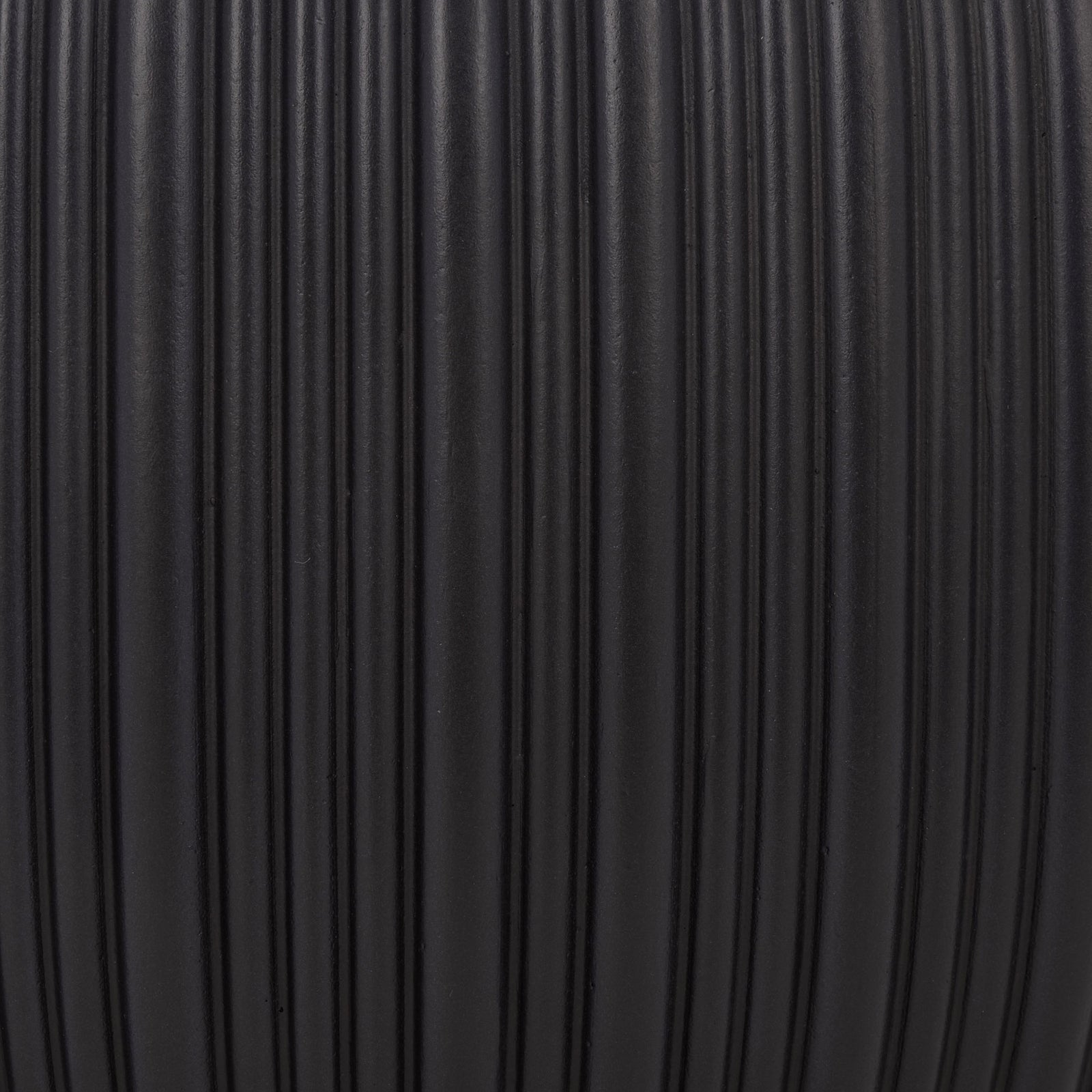 Light catches the closely spaced grooves of the matte black finish. || PAT4602A-SET3 || swatch_studio