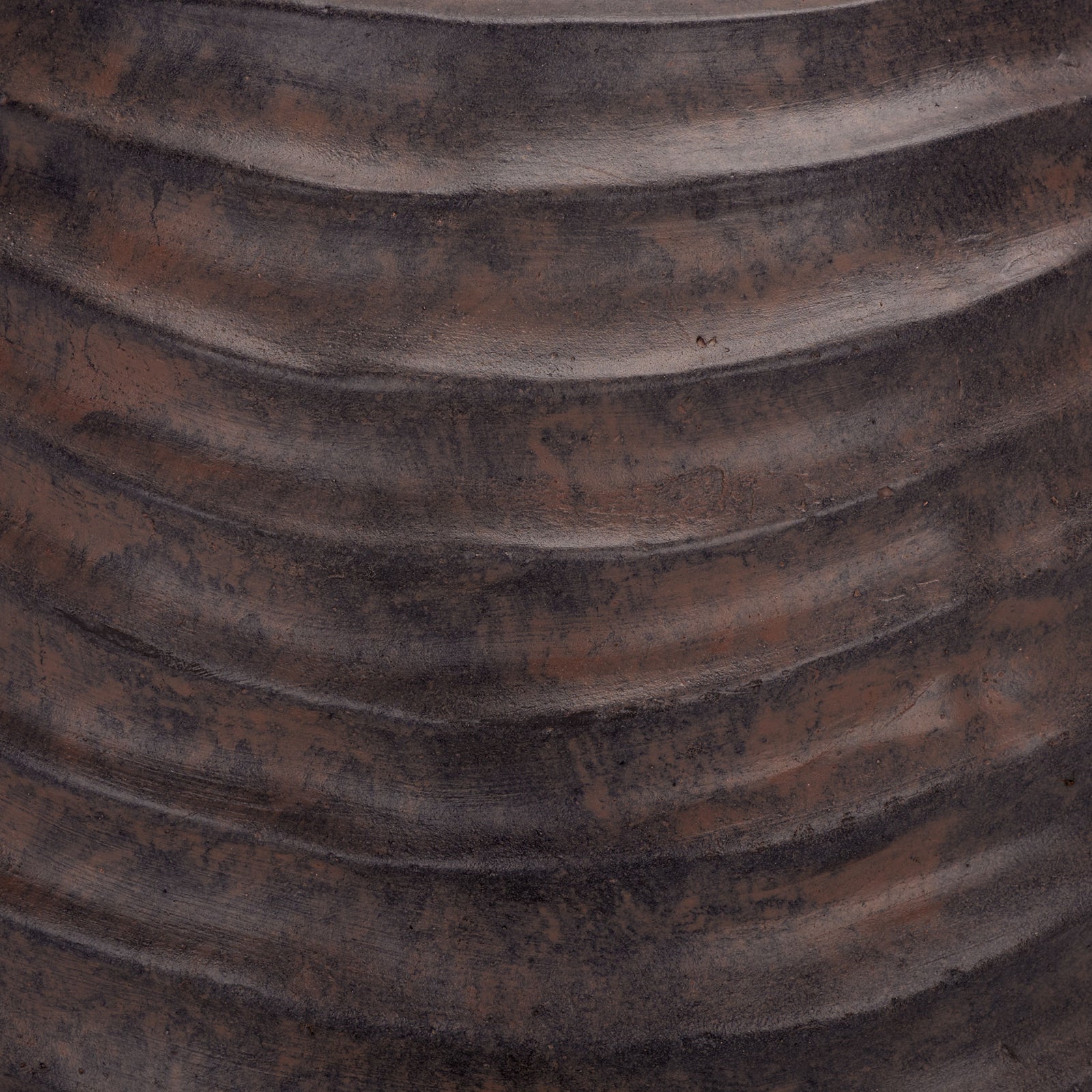 Earthy brown and charcoal tones add dimension to the planter's rippled finish || PAT5043B || swatch_studio