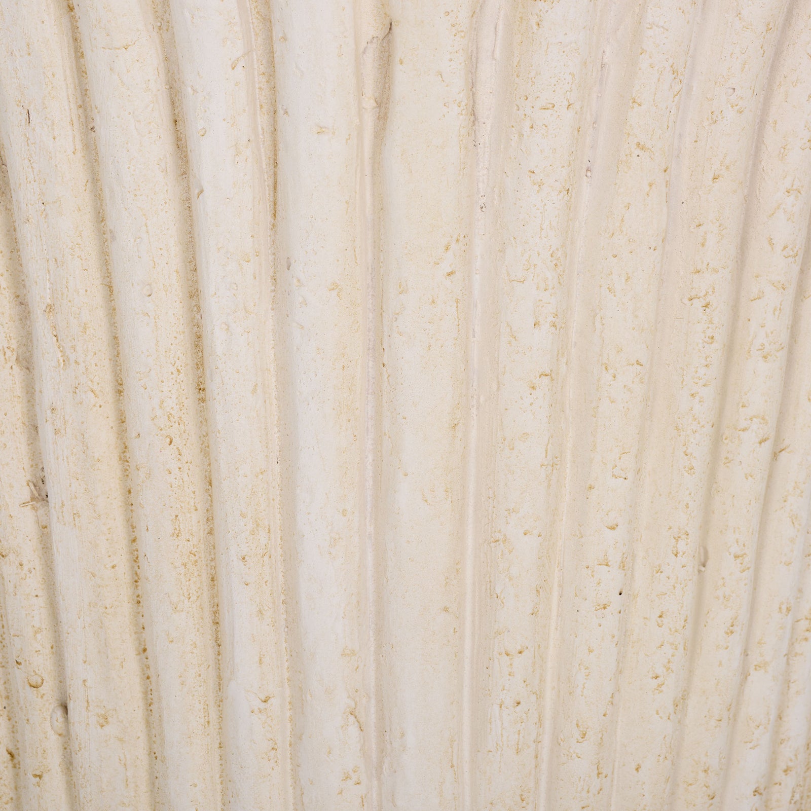 Soft off-white coloring and fine speckling accent the planter's raised flutes || PAT5047A || swatch_studio