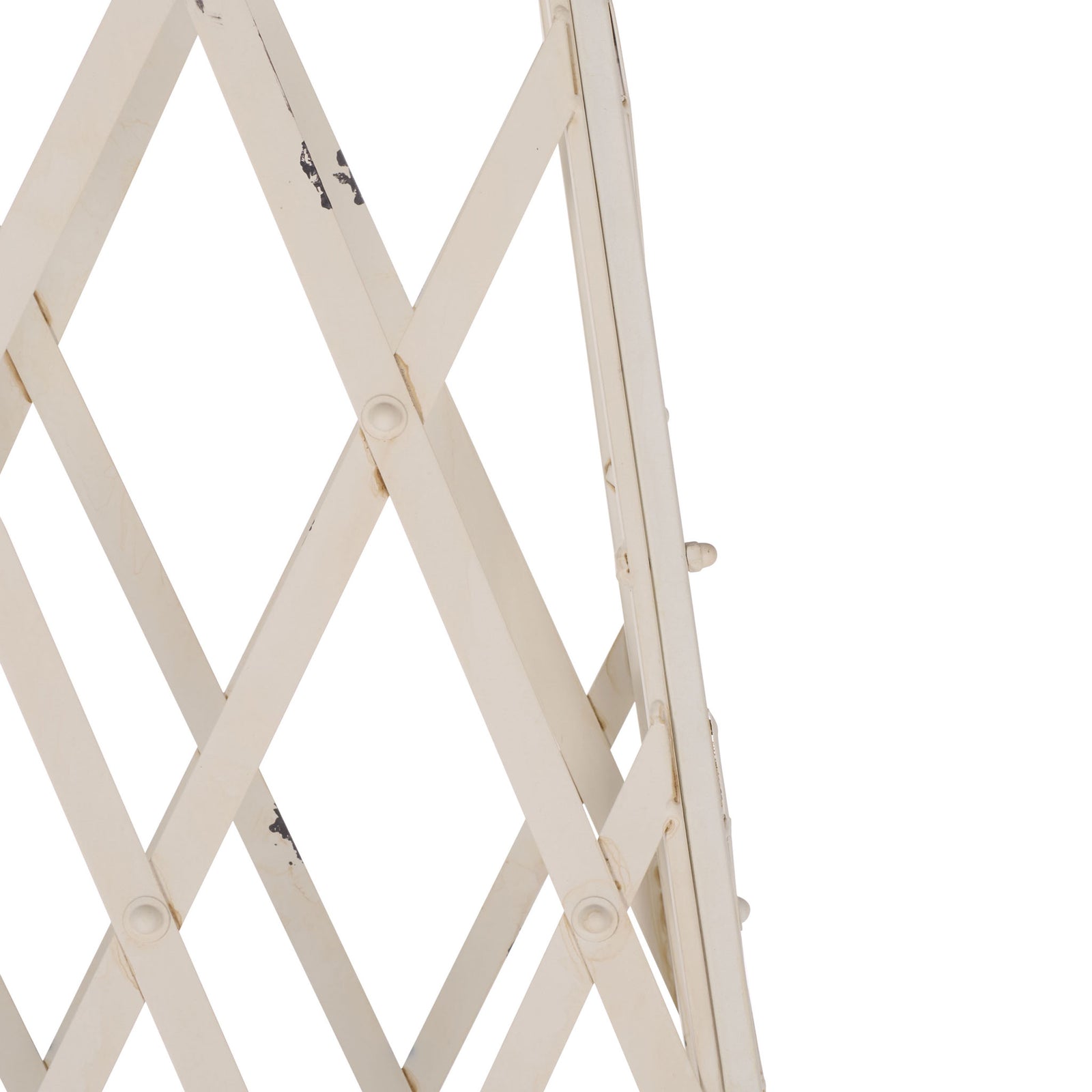 Distressed antique white iron strips cross to form an airy diamond trellis for climbing plants. || PAT5048A || detail_studio