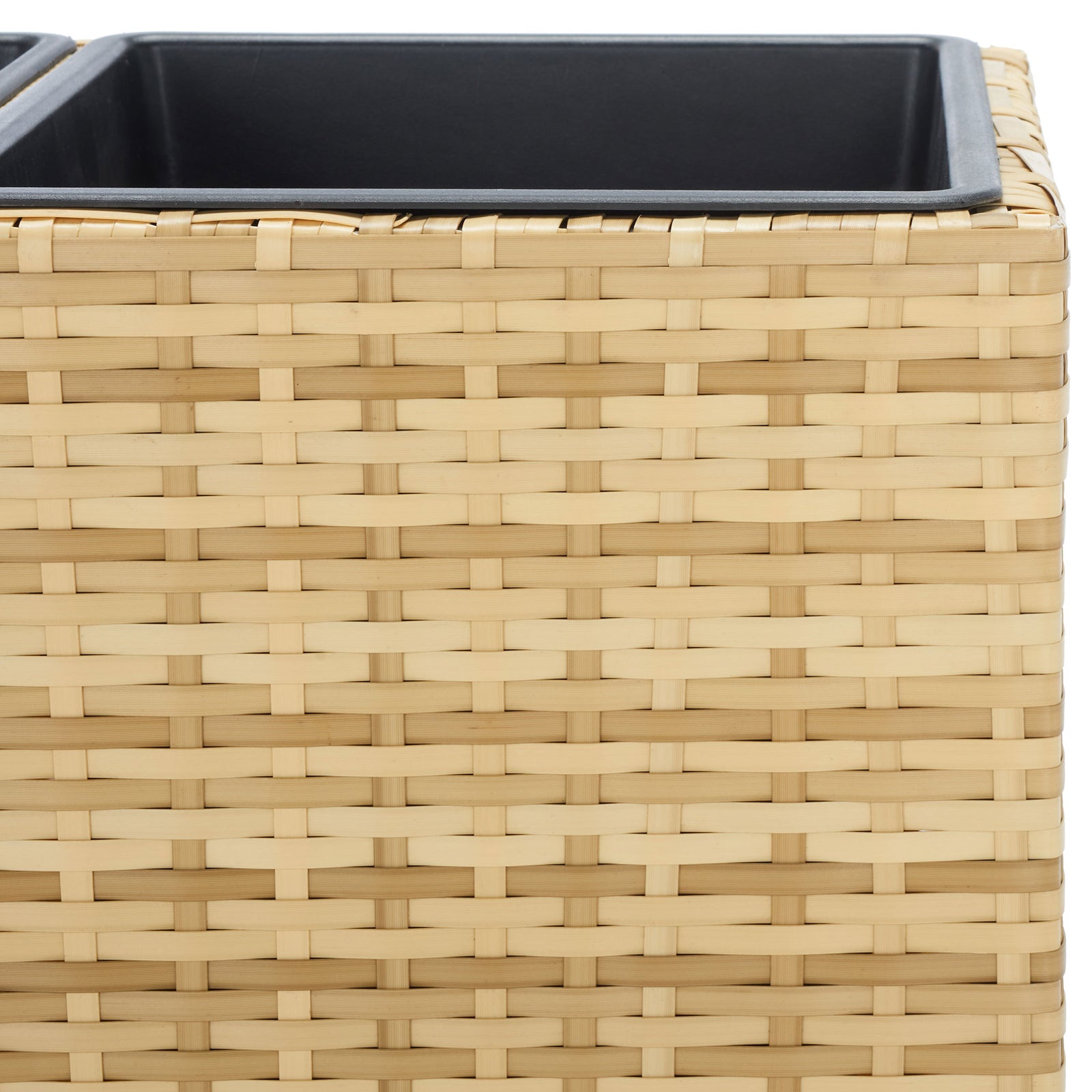 Natural-toned wicker weave borders the smooth rim of a deep black planting insert. || PAT7705D || detail_studio