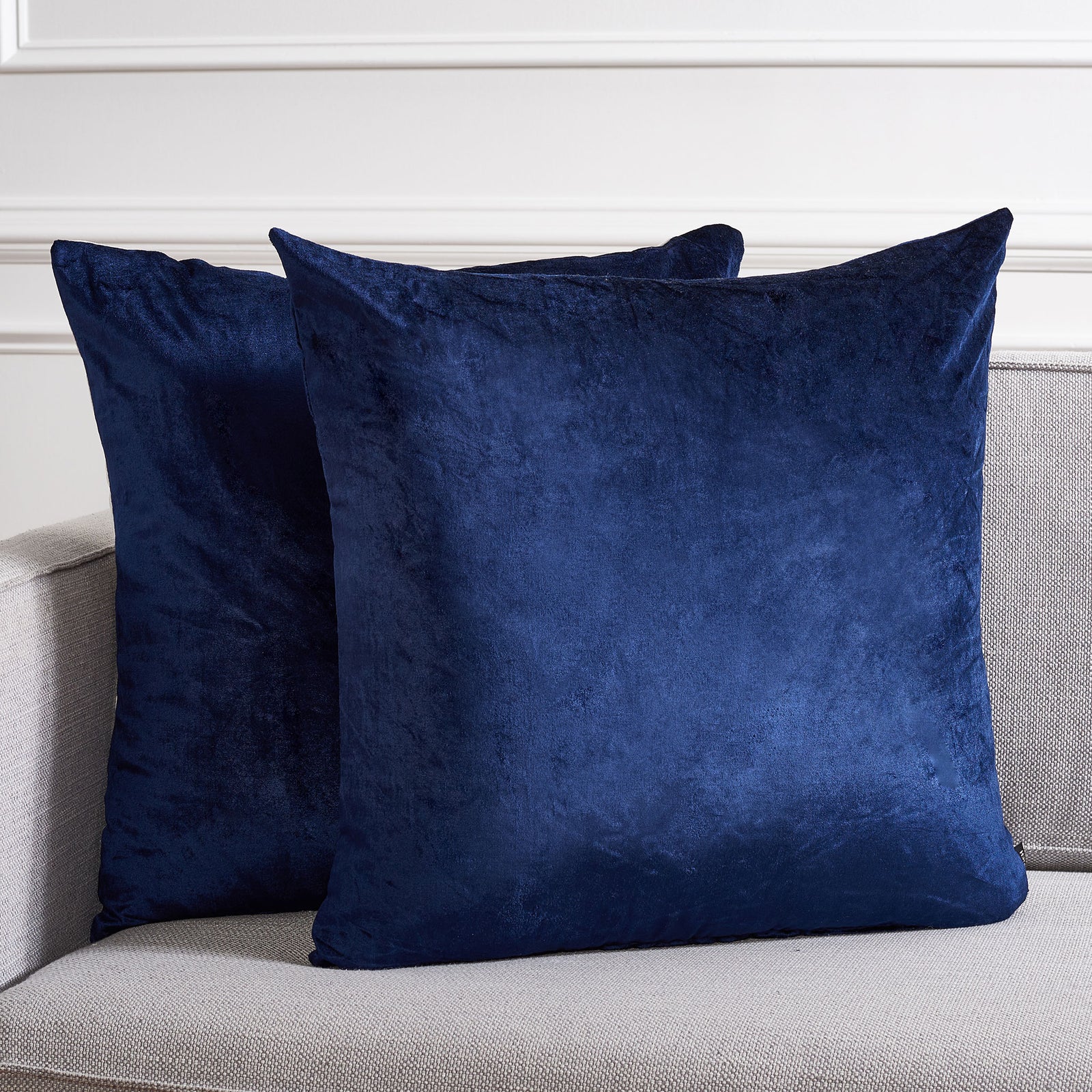 Two roomy navy pillows create a cozy, polished accent against light upholstery. || PLS500C-2222-SET2 || front_multi_room
