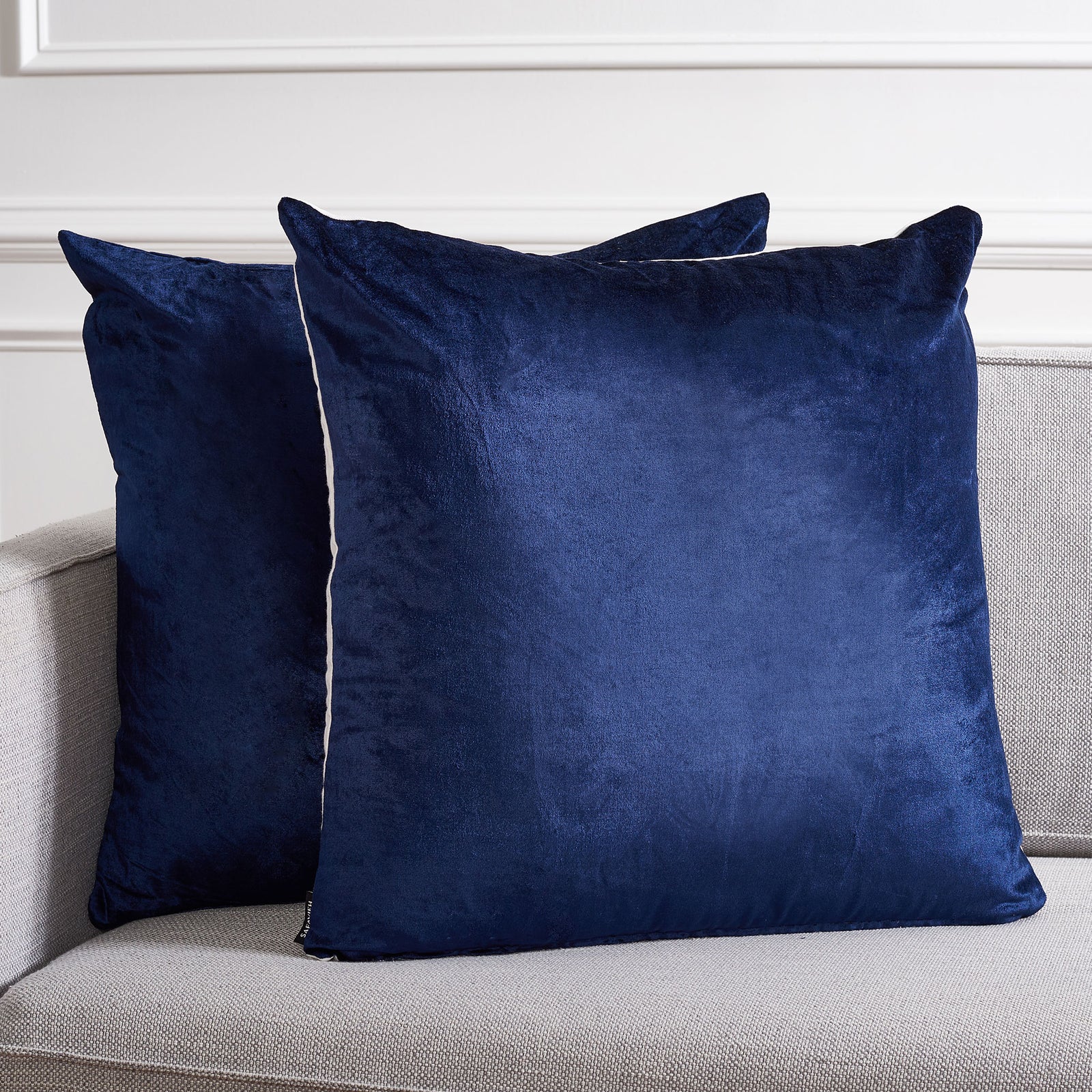 Deep navy pillows add plush color and a subtle sheen to a light gray sofa || PLS503C-2222-SET2 || front_multi_room