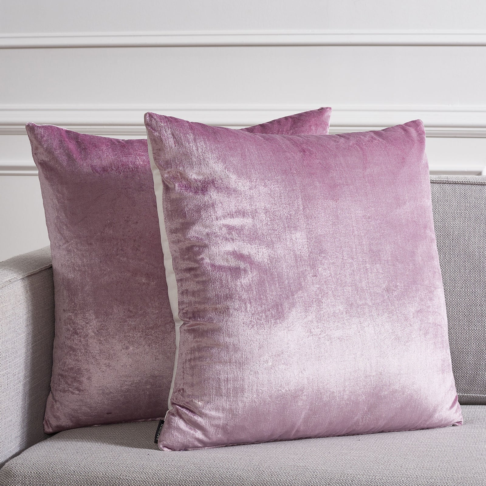 Two generously sized lavender pillows bring soothing color and sheen to gray seating || PLS503D-2222-SET2 || front_multi_room