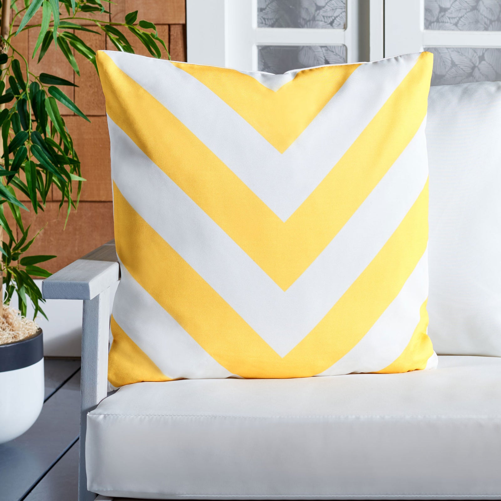 Cheerful yellow chevrons bring lively color to cushioned outdoor seating. || PPL262E-1818 || front_room