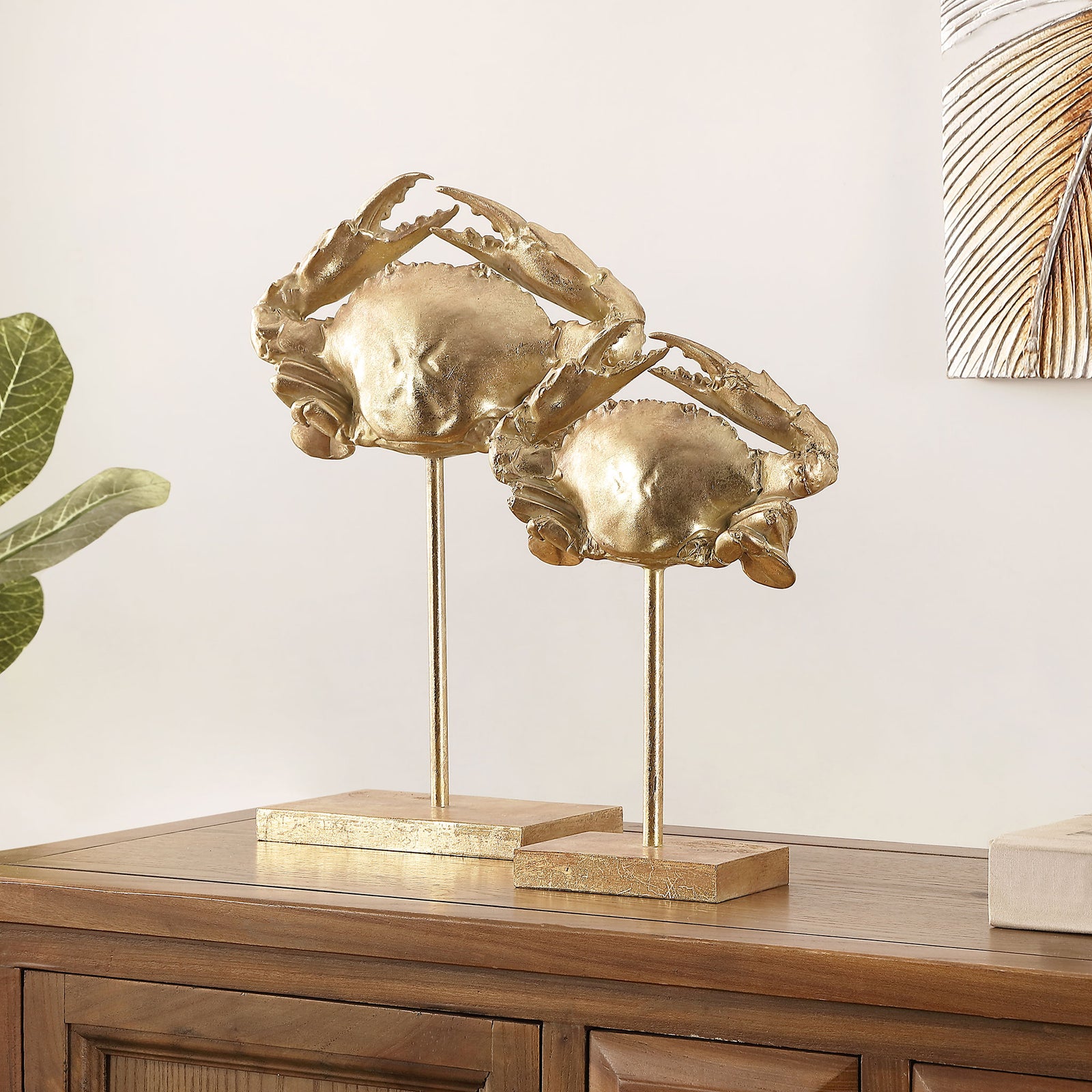 Two gold crab sculptures with raised claws bring a playful coastal accent to a wood console. || RDC1205A-SET2 || front_angle_room