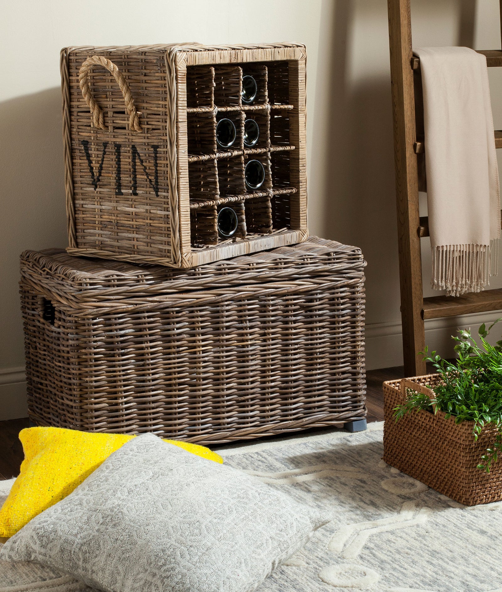 Wine bottles tuck into open wicker cubbies for relaxed, space-saving storage. || SEA7016A || front_angle_room