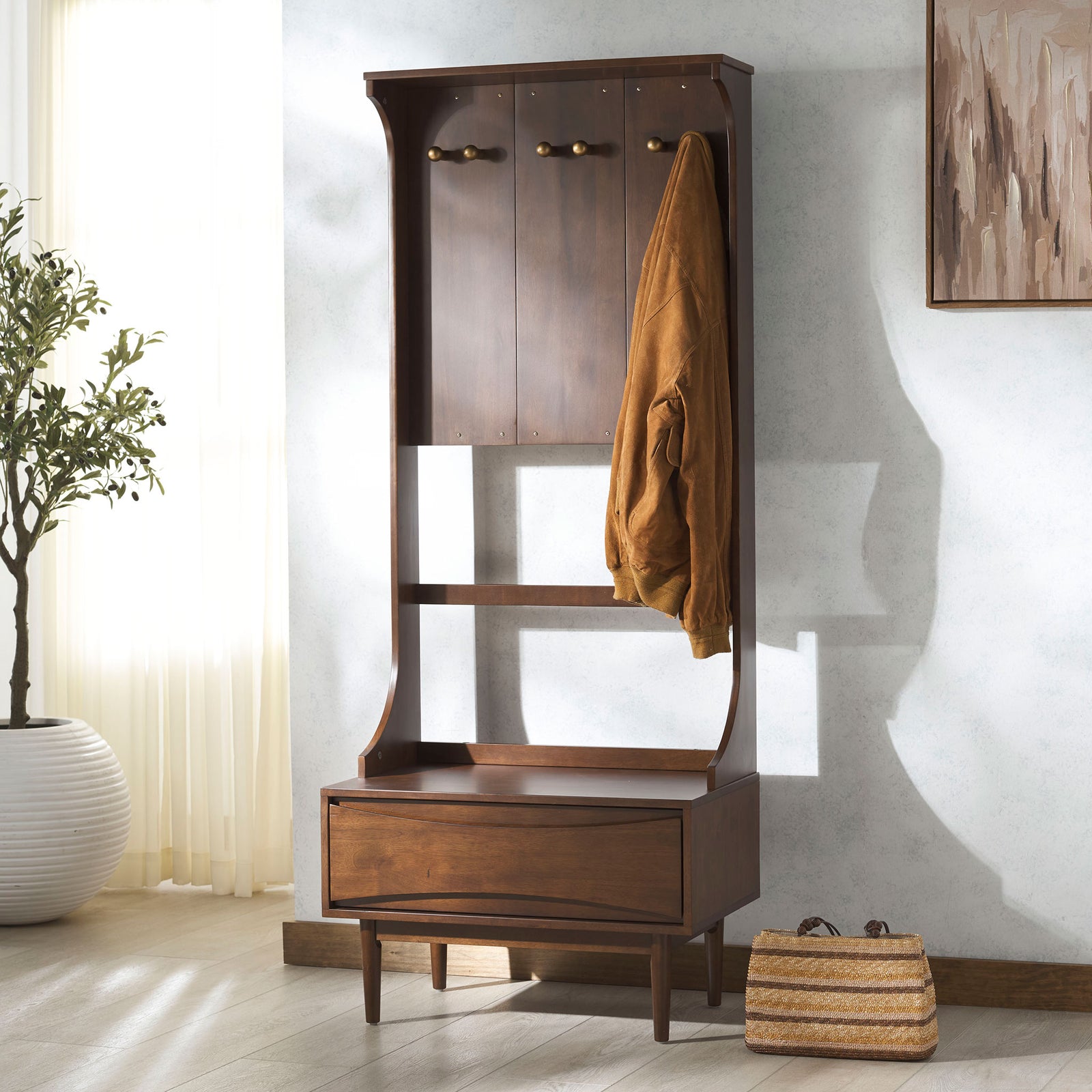 Gold-tone hooks keep outerwear handy above a walnut-finished drawer for everyday essentials. || SFV4224A-2BX || front_angle_room