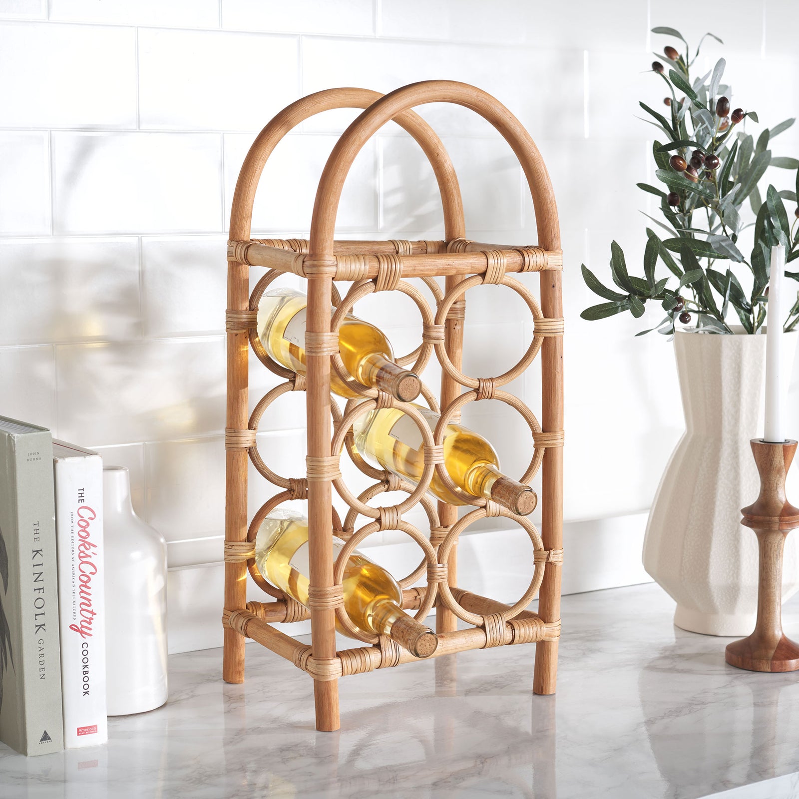 Natural rattan bottle cradles display wine neatly while warming a kitchen counter || STG1800A || front_angle_room