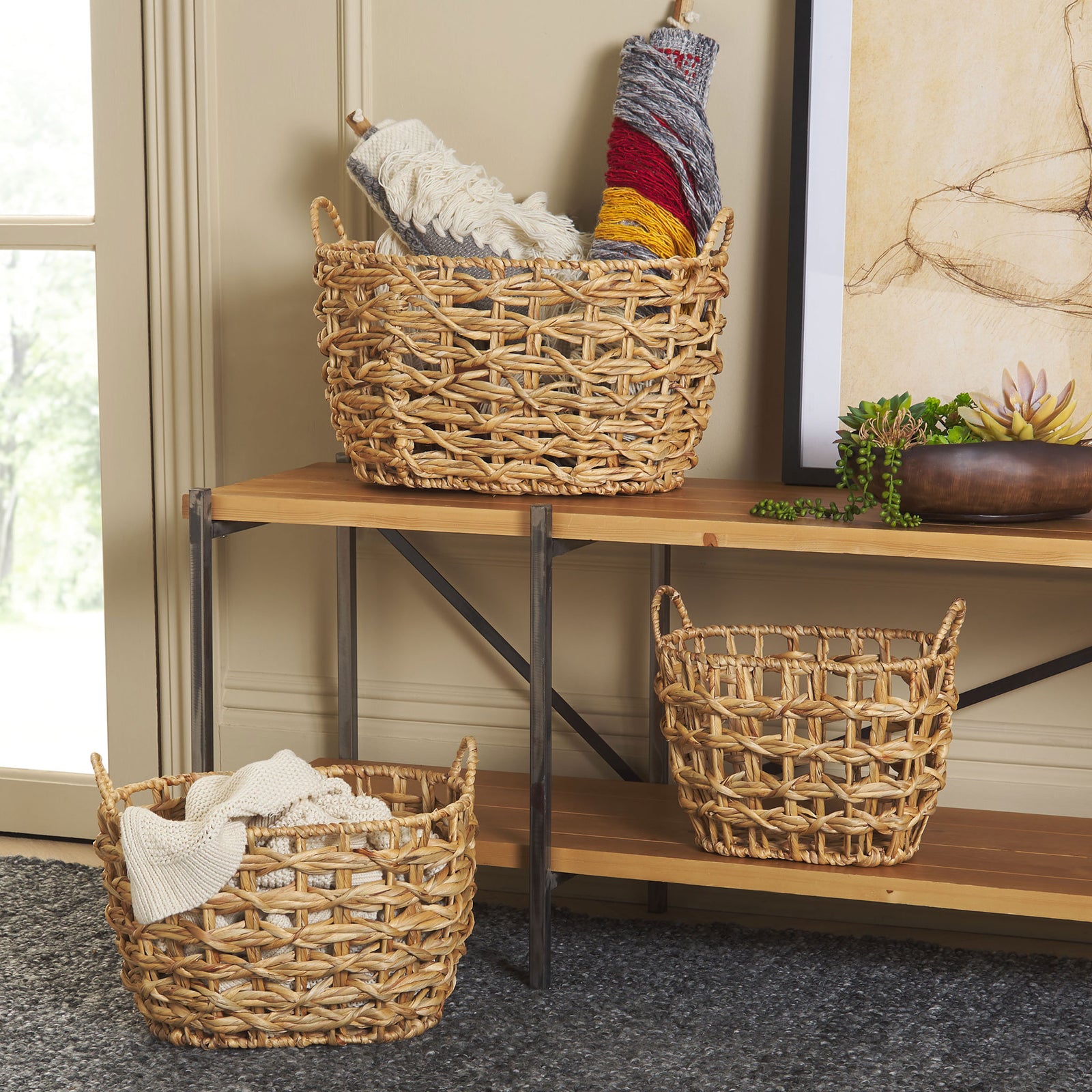 Three woven baskets keep throws and everyday essentials tidy while adding warmth to the room. || STG1806A || front_room