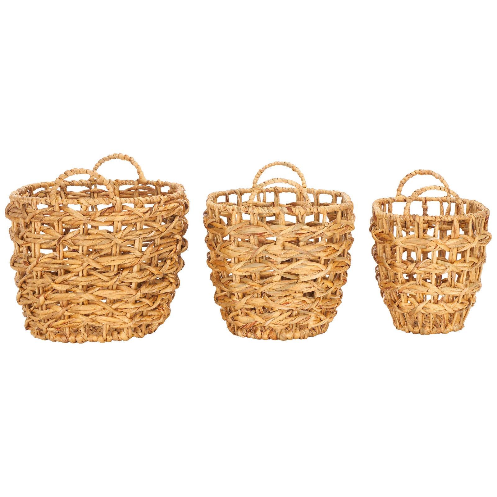 Three differently sized baskets share a natural open weave and curved carrying handles. || STG1806A || side_studio