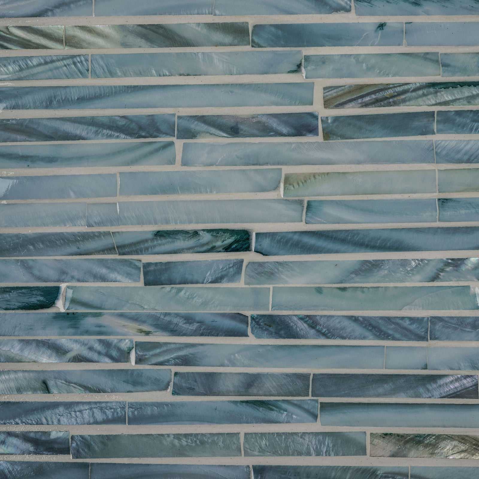 Iridescent blue-gray shell tiles form a slender, staggered mosaic with natural color variation. || STG1812A || swatch_studio