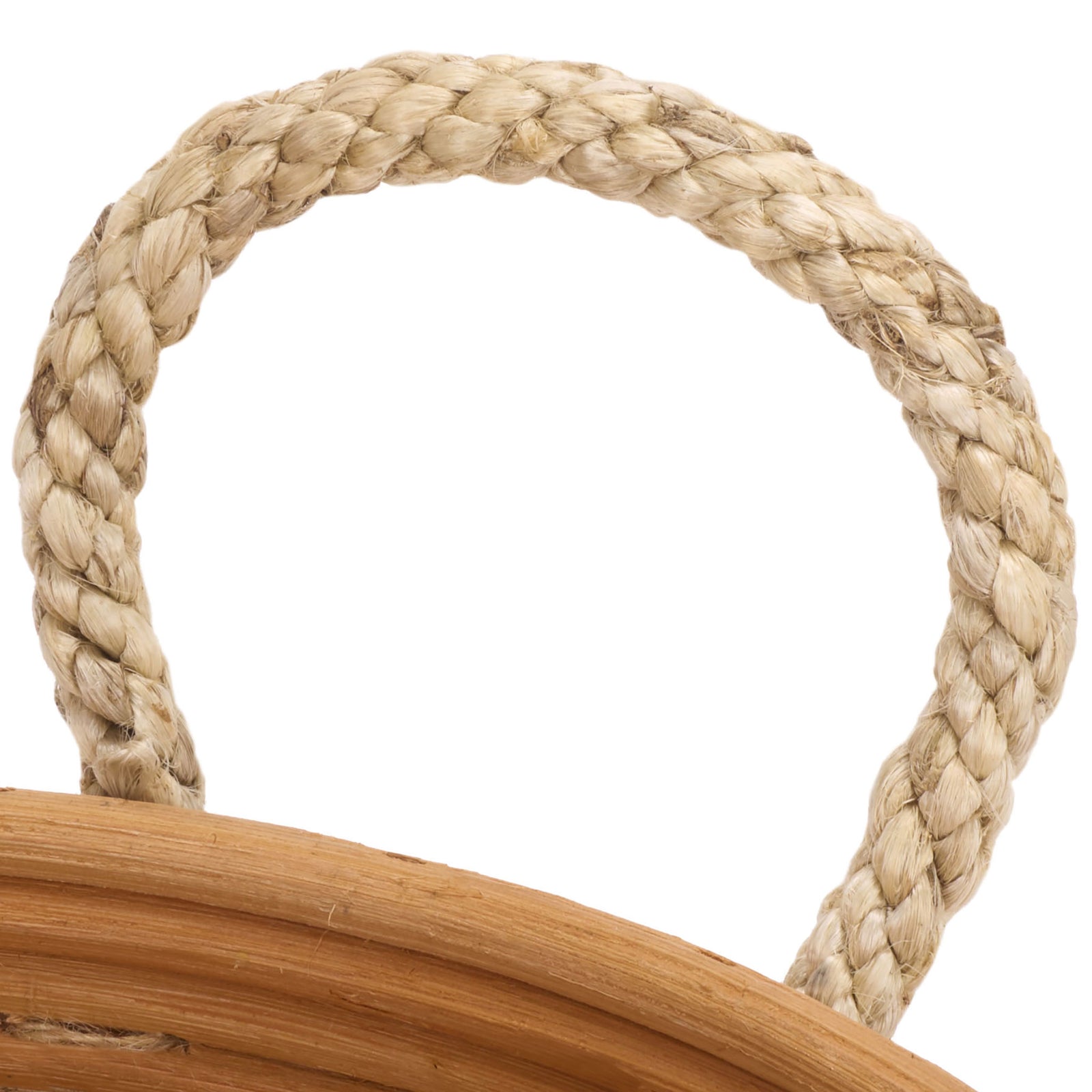 A thick braided handle adds tactile texture to the natural rattan basket. || STG1817A || handle_studio
