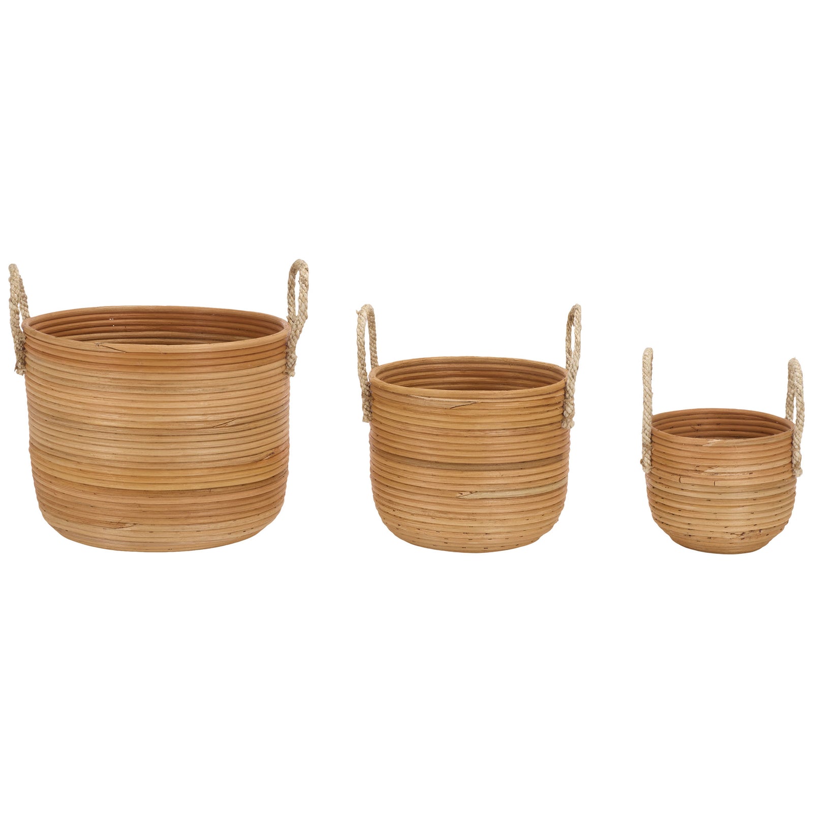 Graduated natural rattan baskets sit side by side, each with a broad opening and woven handles. || STG1817A || side_studio