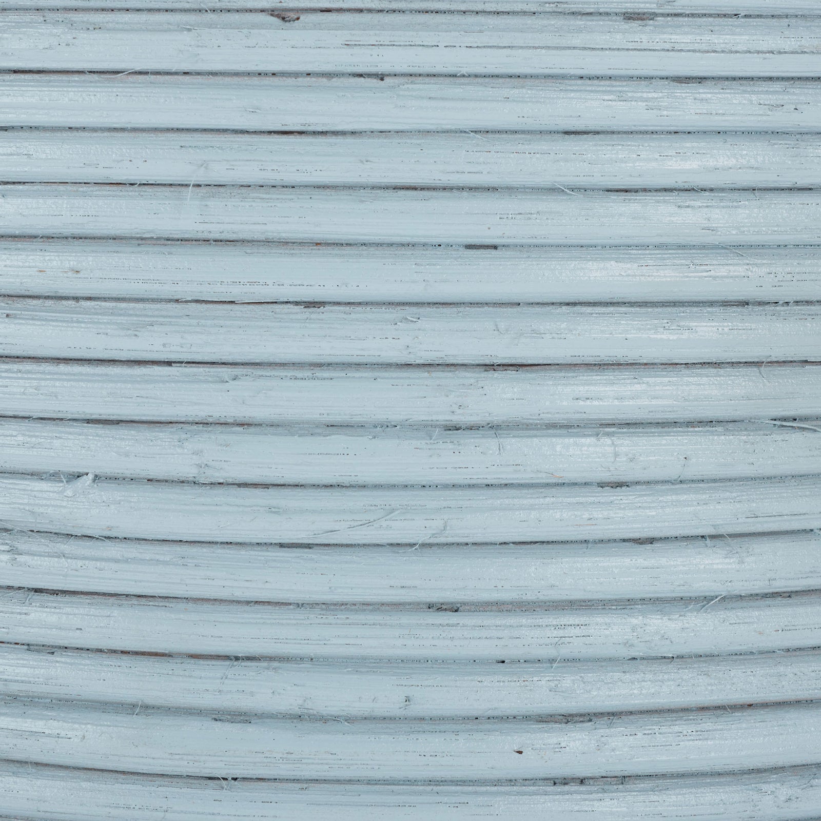 A pale blue finish highlights tightly coiled rattan texture and subtle natural striations. || STG1817B || swatch_studio