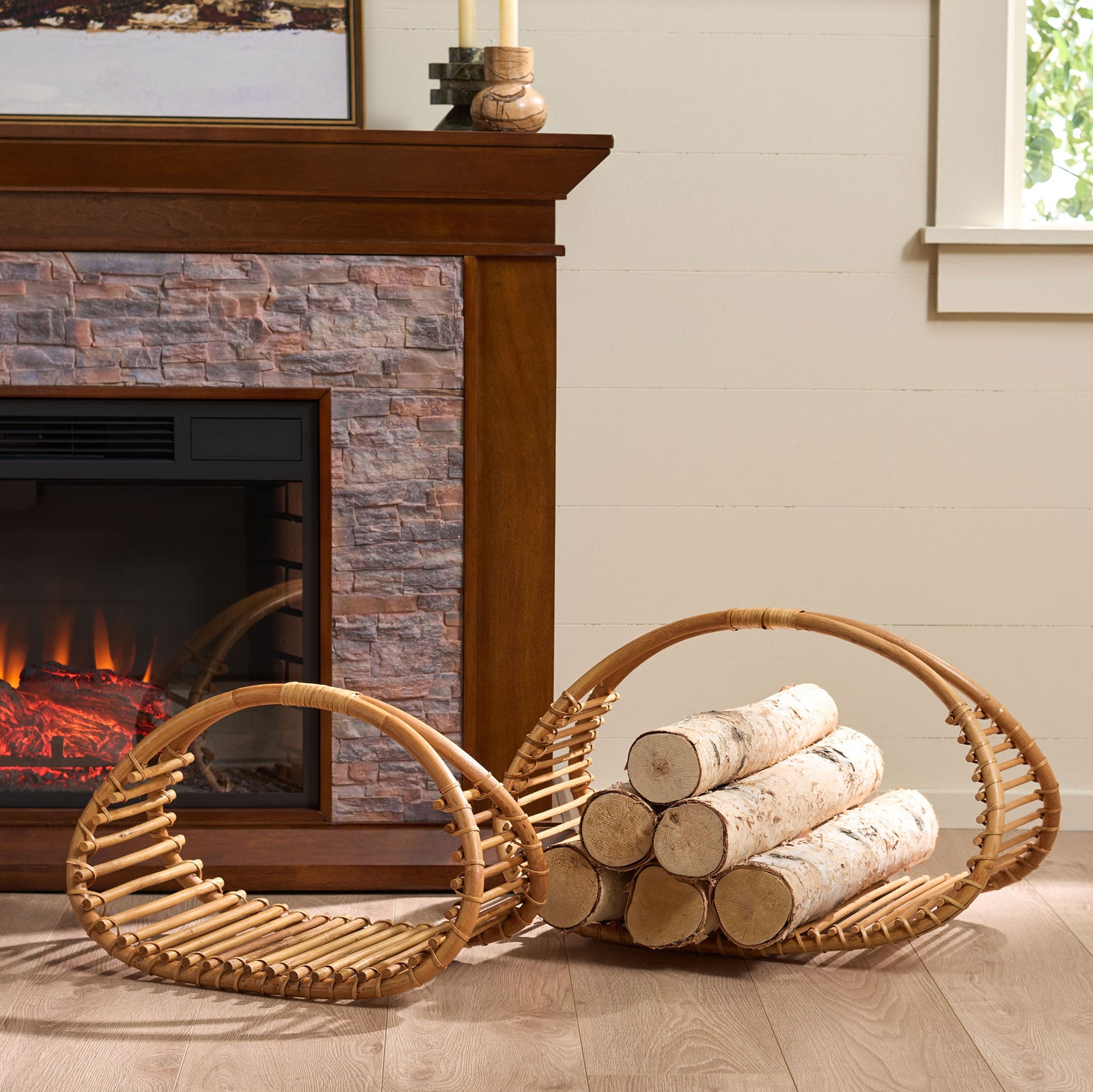 Two curved rattan baskets organize firewood beside the hearth and add natural warmth. || STG1819A || front_angle_room