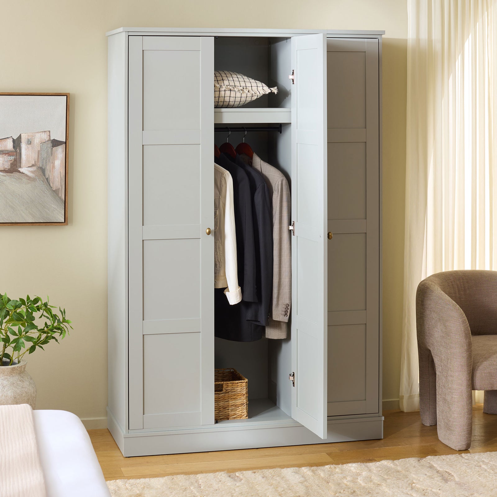 An open center door shows hanging clothes below a shelf, with closed storage at either side. || STG3103A-3BX || front_angle_open_room