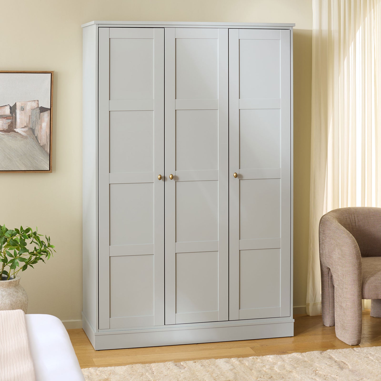 Light gray three-door wardrobe offers tidy enclosed storage in a softly styled bedroom. || STG3103A-3BX || front_angle_room