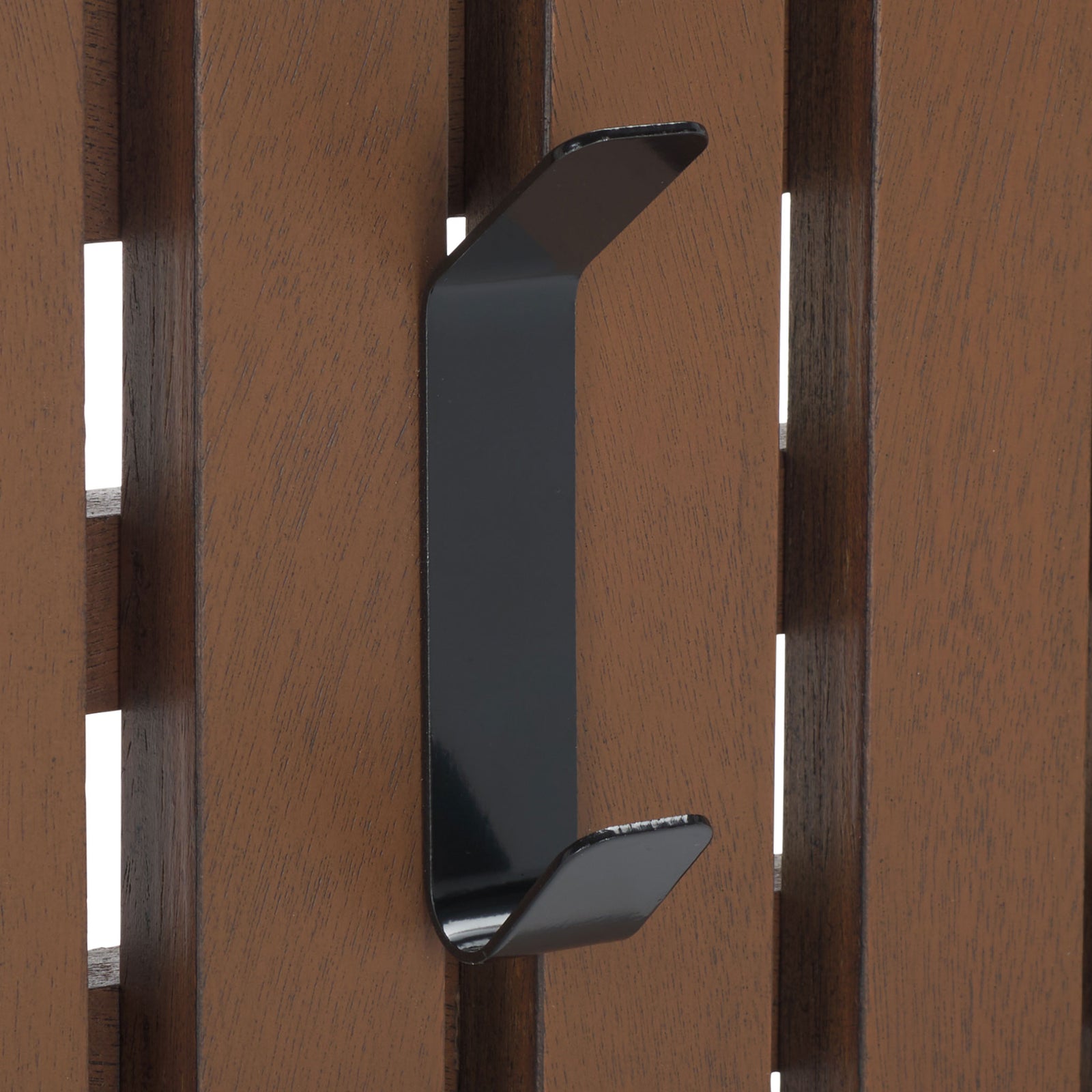 A black dual-prong hook adds everyday utility to warm medium brown wood slats. || STG5704M || detail_studio