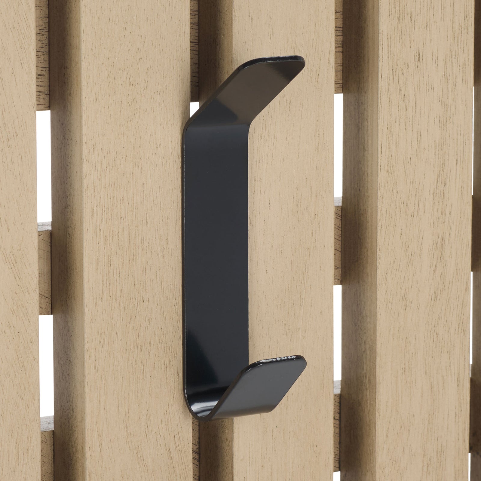 A black two-tier hook contrasts with pale sand-colored wood slats for practical hanging space. || STG5704N || detail_studio