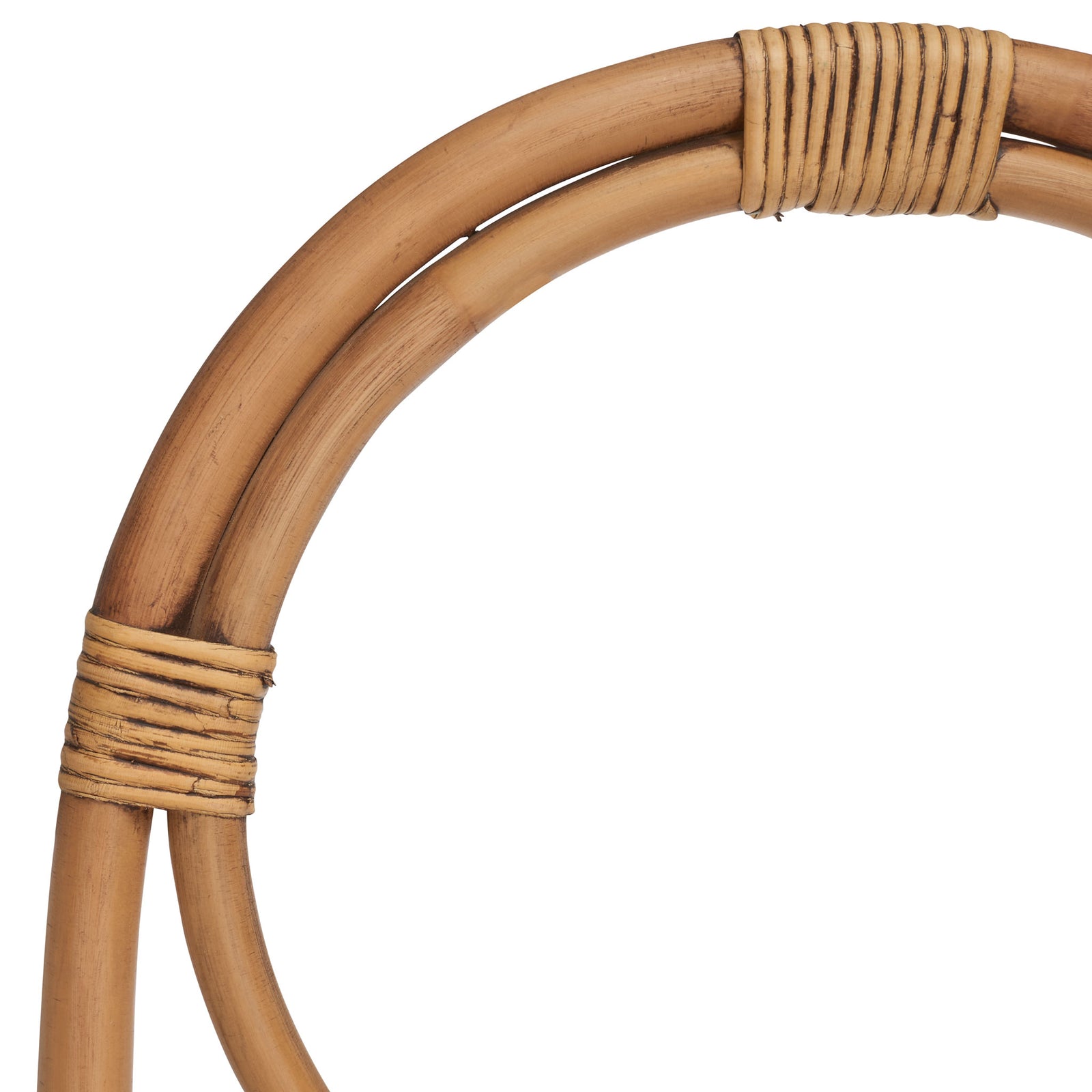 Honey-brown rattan curves meet at tightly wound bindings, showing warm, varied grain. || STG6501C || detail_studio