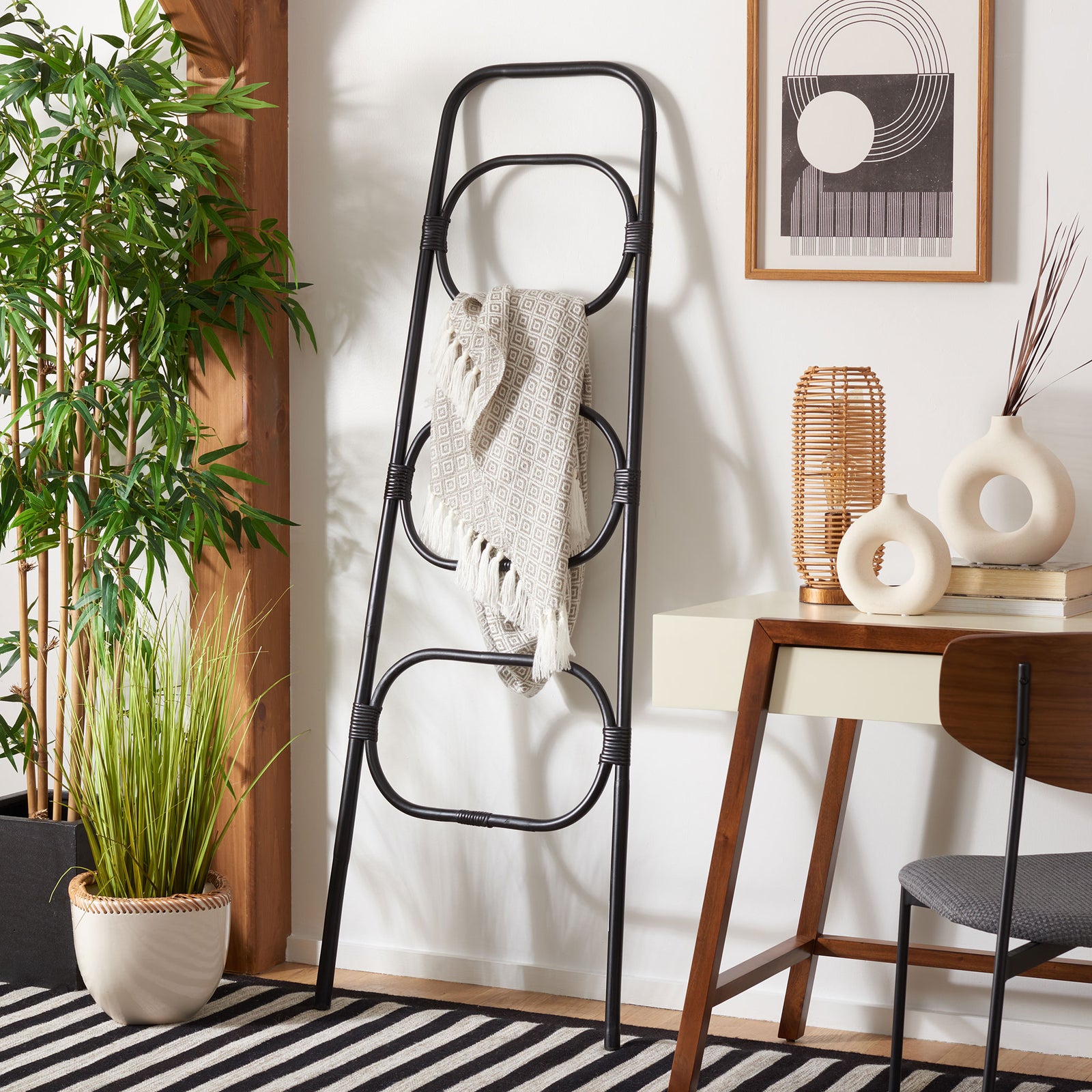 Black rattan loops keep a cozy throw within reach while adding airy texture to the room || STG6502B || front_room