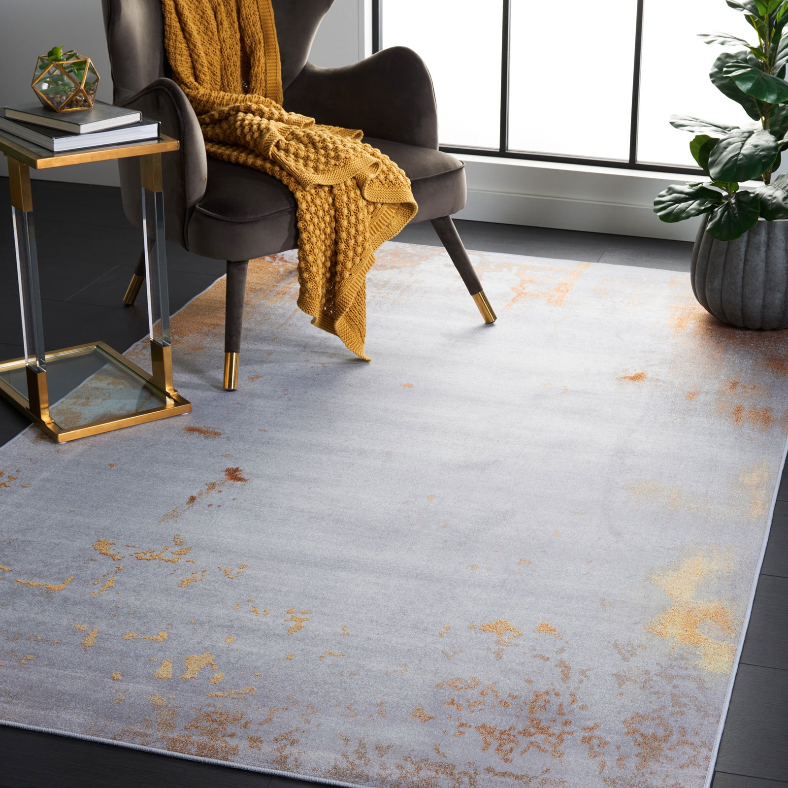 Abstract gray rug brings cozy texture and coppery accents to a bright lounge || TAC802P-5 || front_angle_room