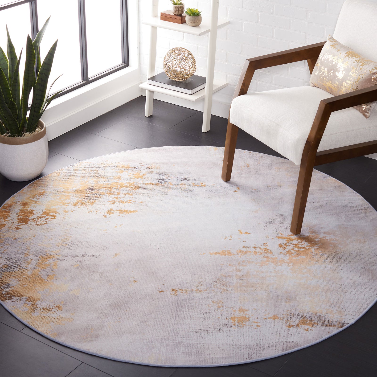 Round gray and gold abstract rug anchors the space with a sleek, modern statement || TAC805F-6R || top_room