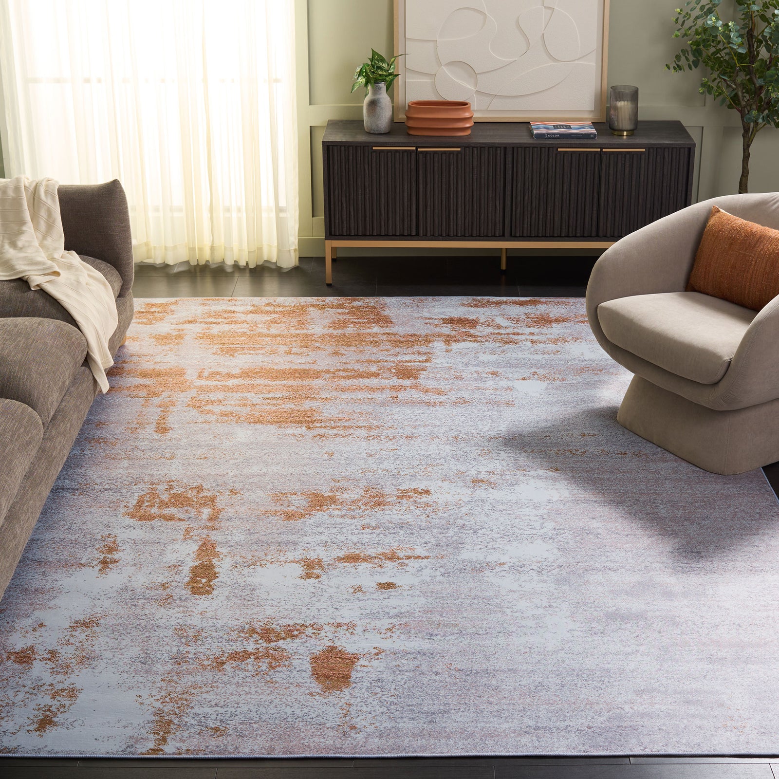 Contemporary gray and rust rug adds warm dimension to the living room with its soft, low-profile texture || TAC808P-8 || top_angle_room