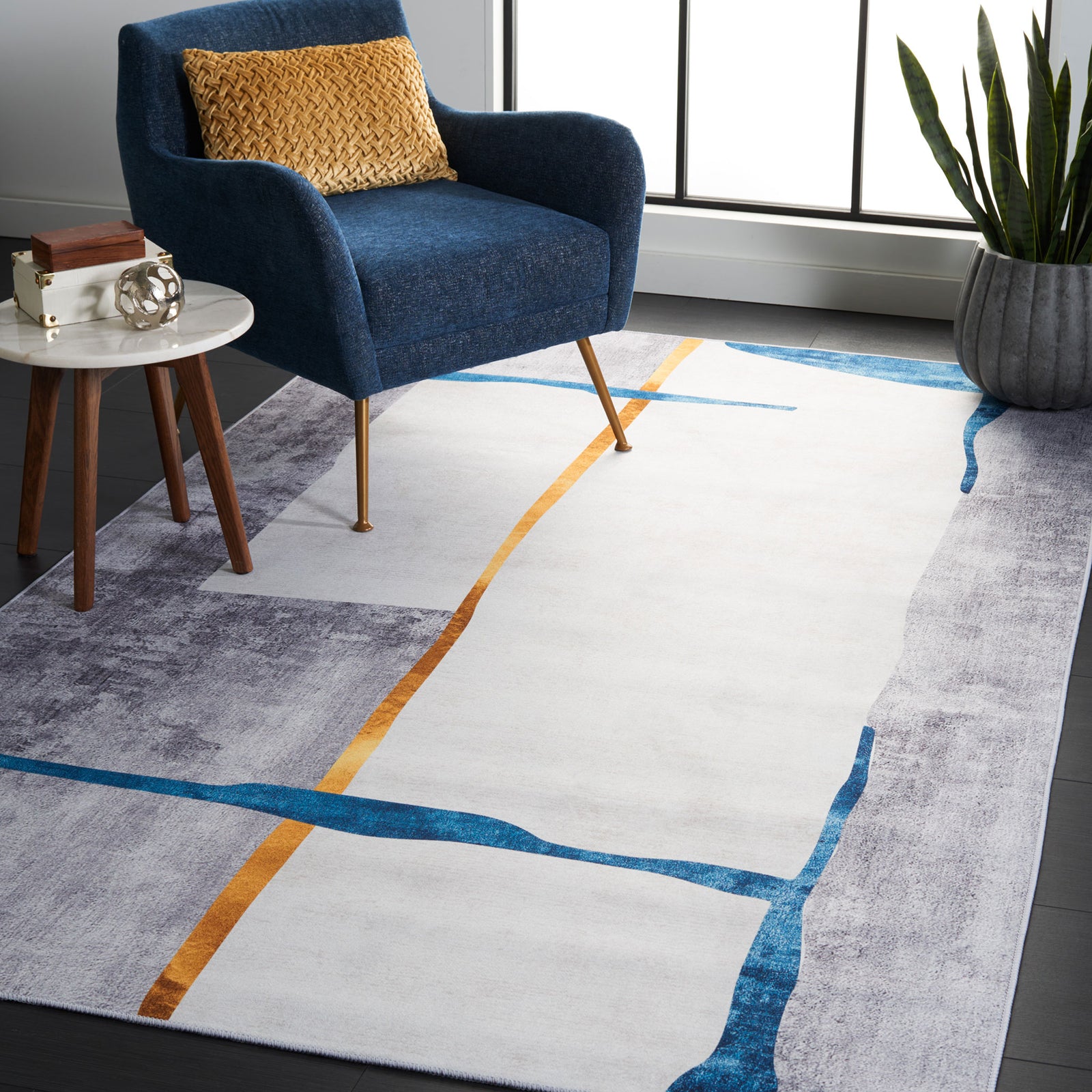 Modern abstract rug in gray with teal and gold lines brings bold color and easy-care comfort to living spaces || TAC820F-5 || front_angle_room