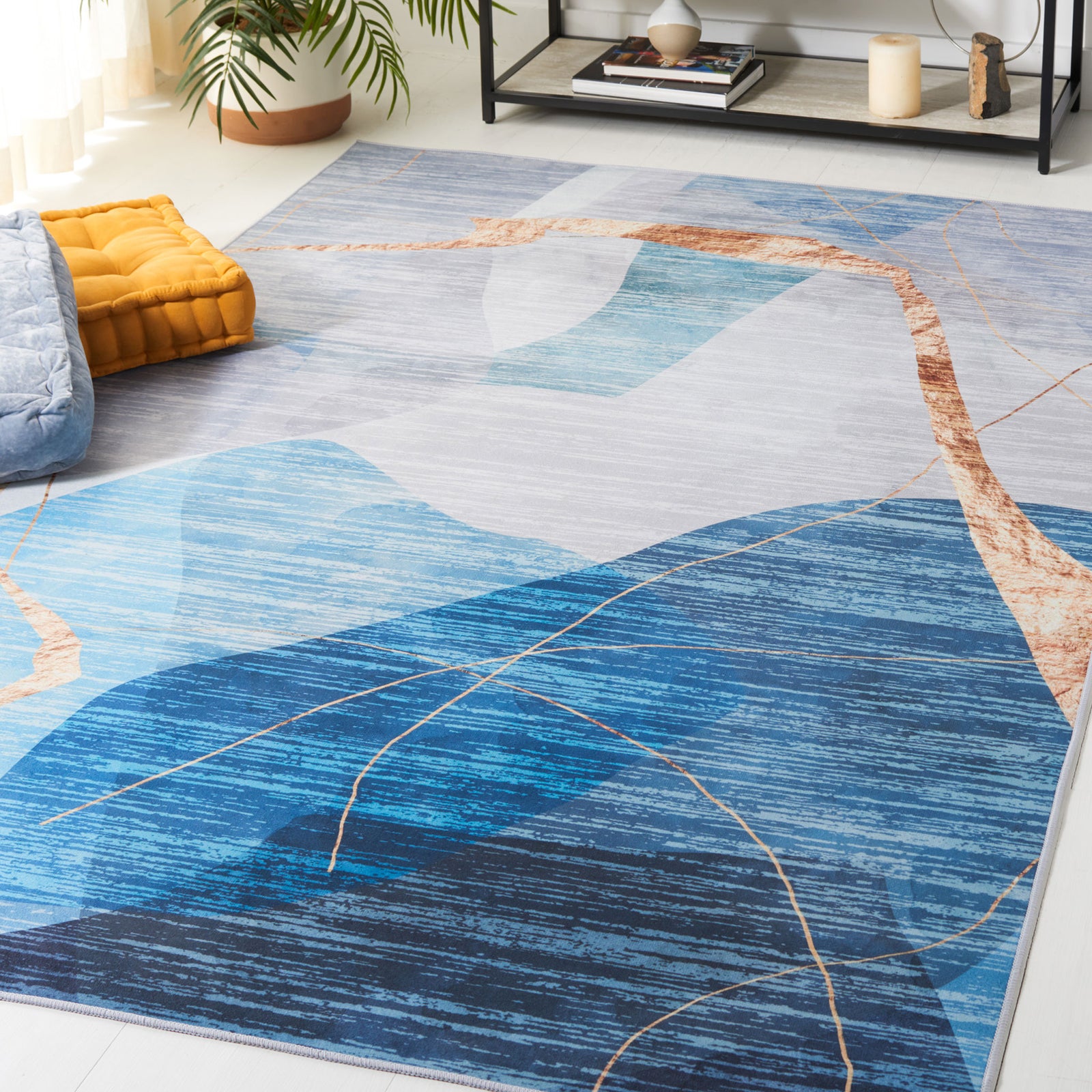 Modern abstract rug anchors the room in layered blues with warm copper accents || TAC836M-5 || top_angle_room