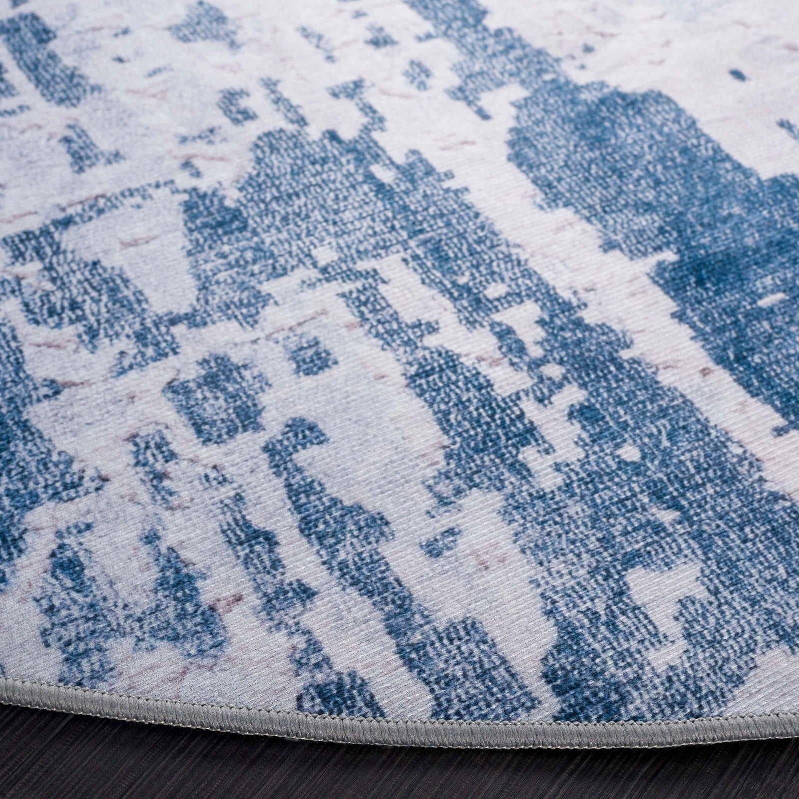 Bound edge and textured abstract gray and navy pattern on this soft, washable rug || TAC864F-6R || detail_studio