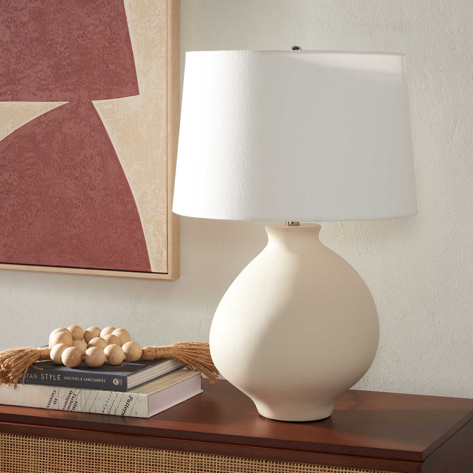 Sculptural white ceramic lamp brings minimalist elegance to a console or bedside || TBL2009A || front_room