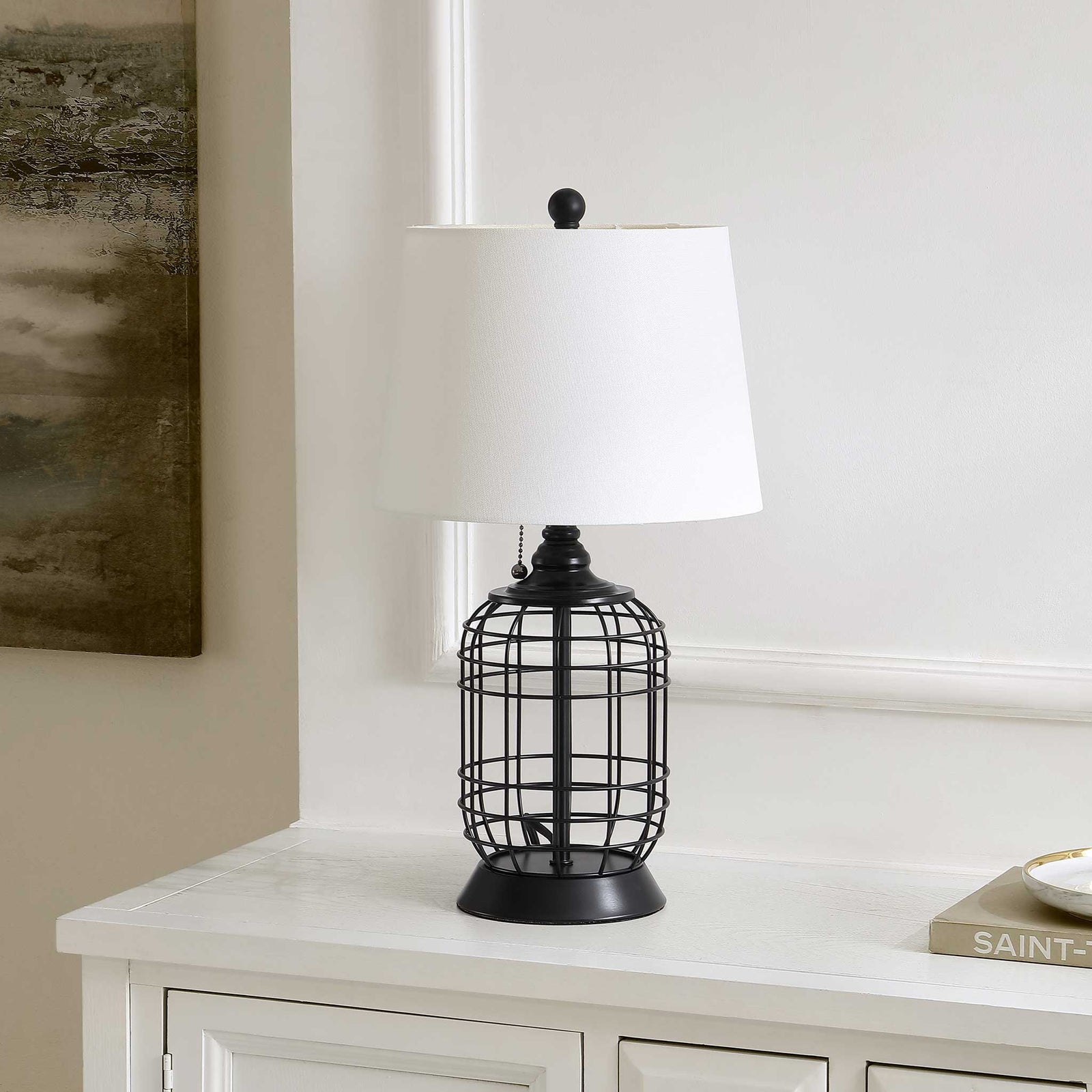 Graphic openwork black base and crisp white shade bring bold contrast to your decor || TBL4490A || front_angle_room