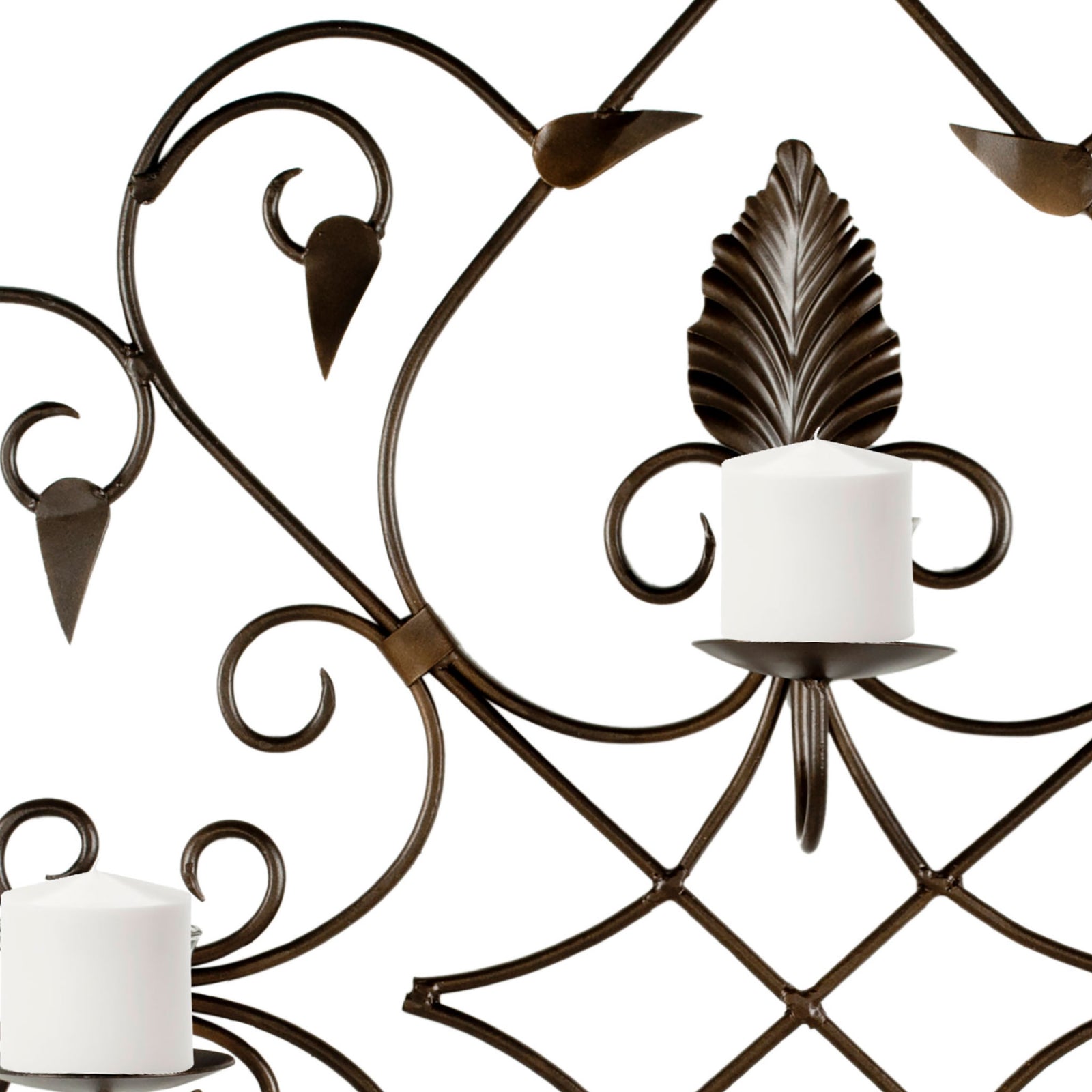 Leaf accents and graceful rust-toned iron scrolls frame a white pillar candle. || WDC1004A || detail_studio