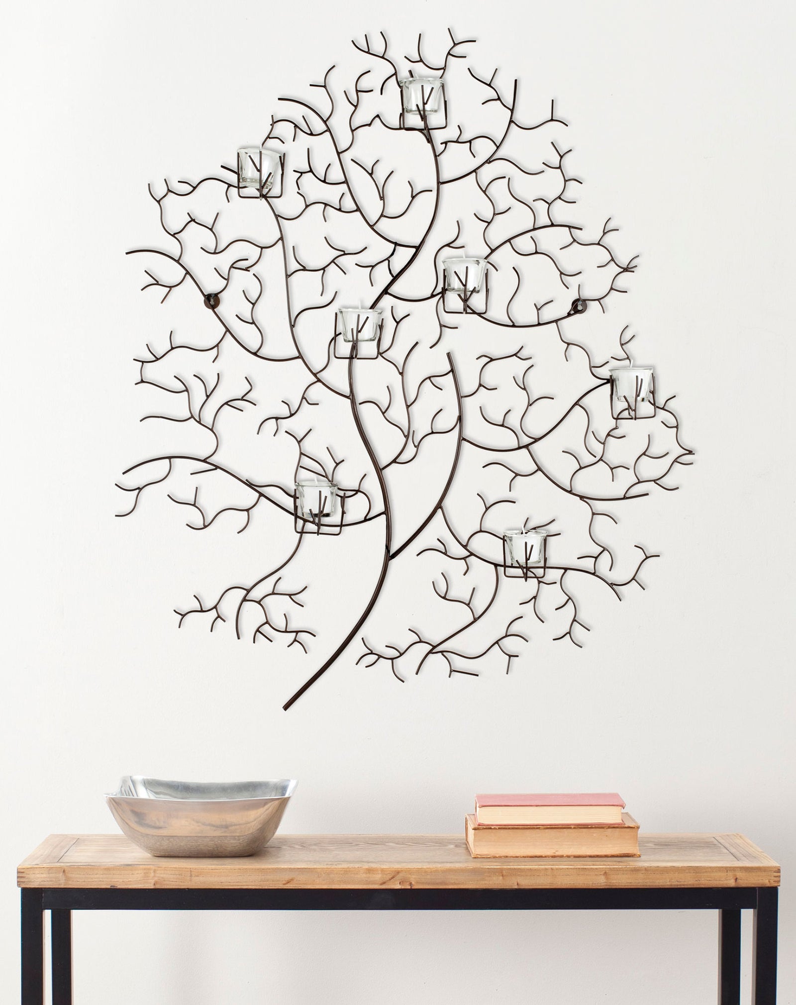 Branching iron wall decor supports seven clear glass votives for an airy, nature-inspired accent. || WDC1018A || front_room