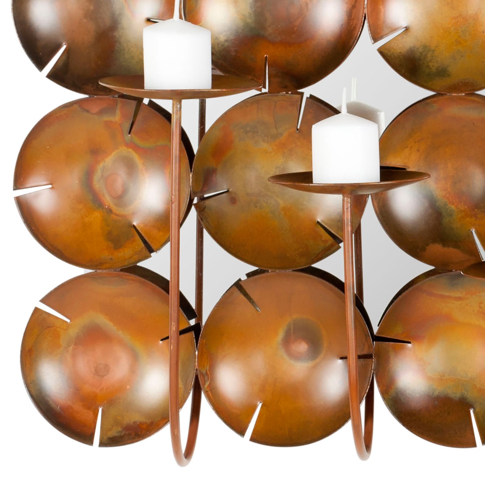 Mottled copper discs contrast with slender candleholders and white pillar candles. || WDC1020A || detail_studio