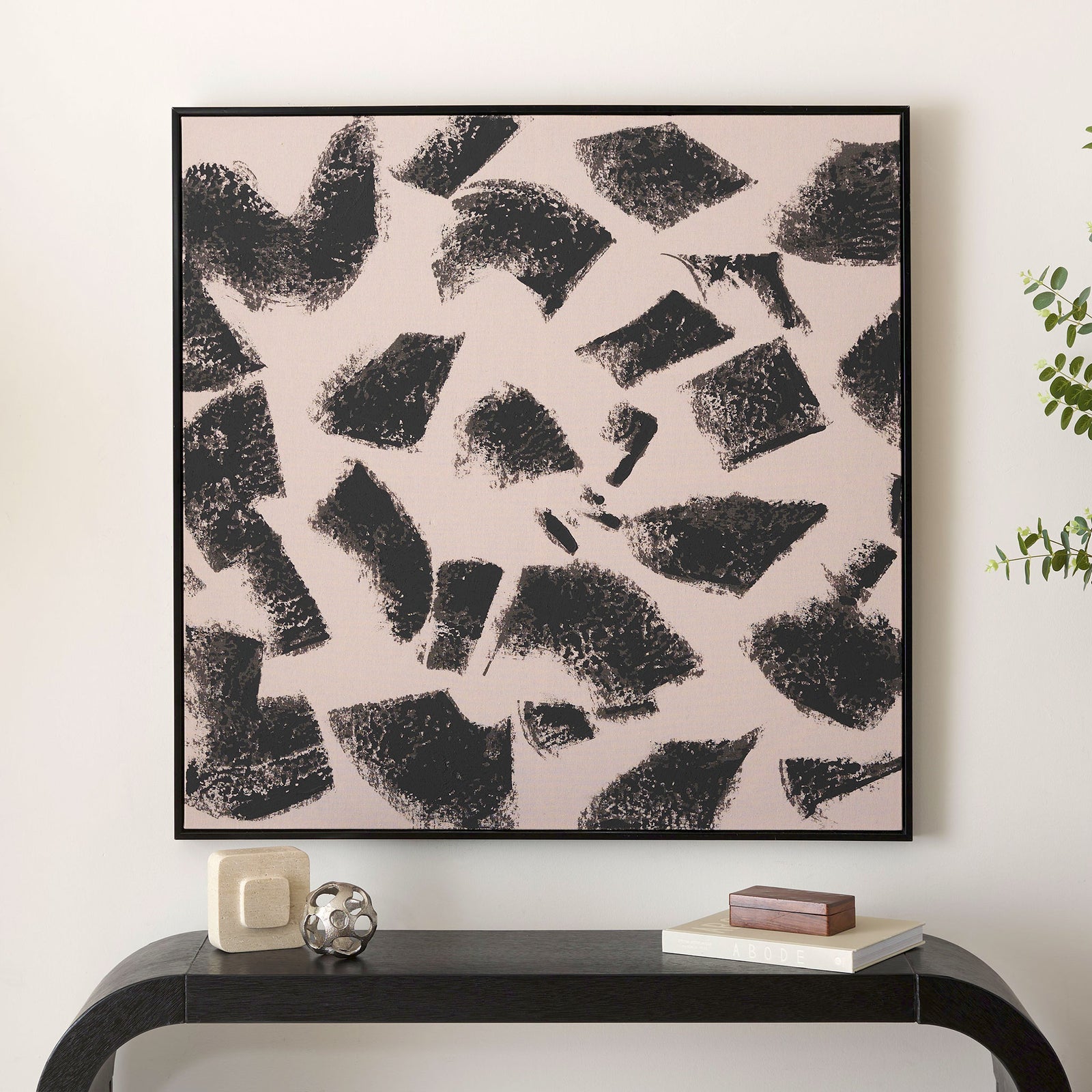 A striking black-and-taupe composition brings graphic contrast to a calm, neutral room. || WLA2079A || front_room