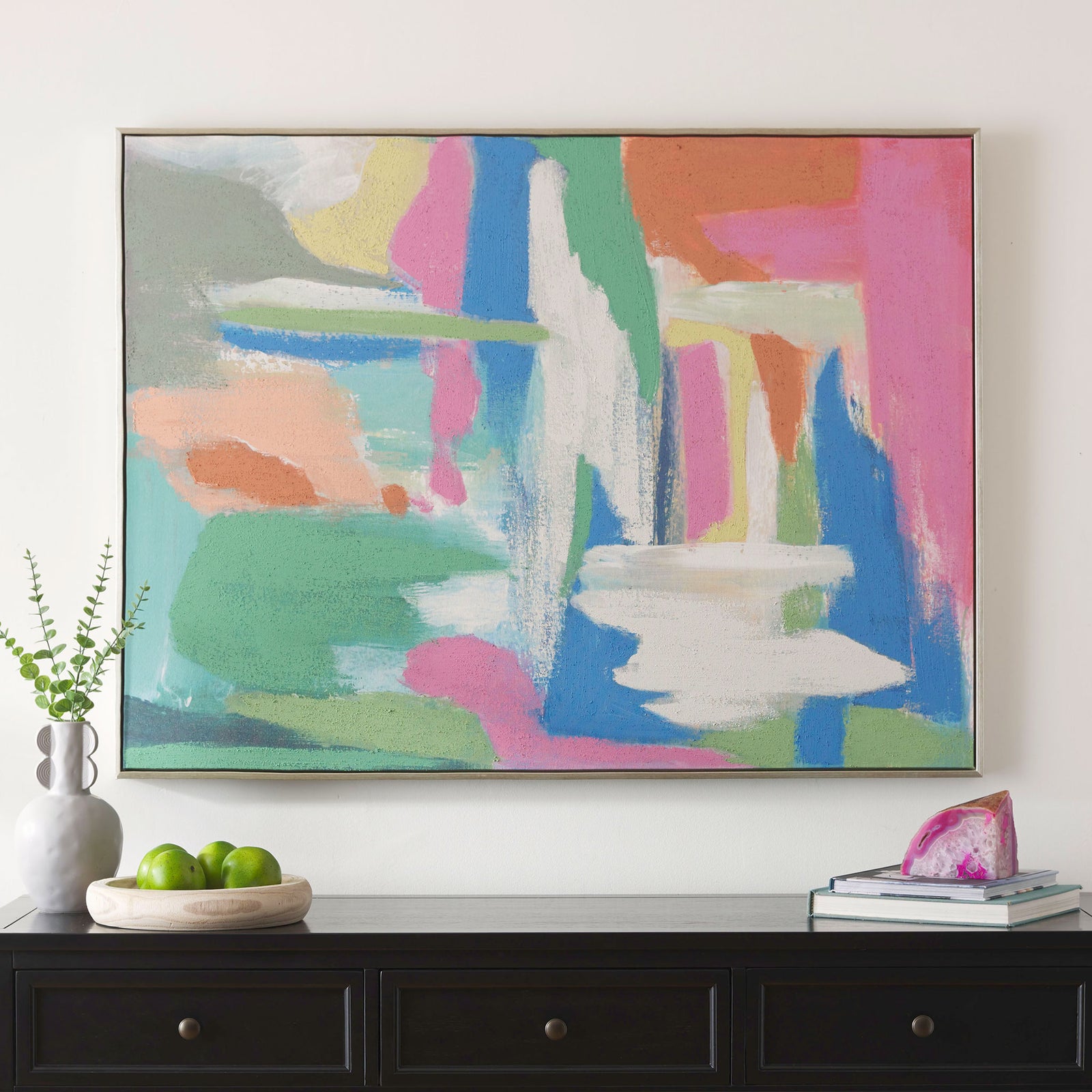 A colorful abstract canvas brings playful energy to the room with its layered brushstrokes. || WLA2081A || front_room