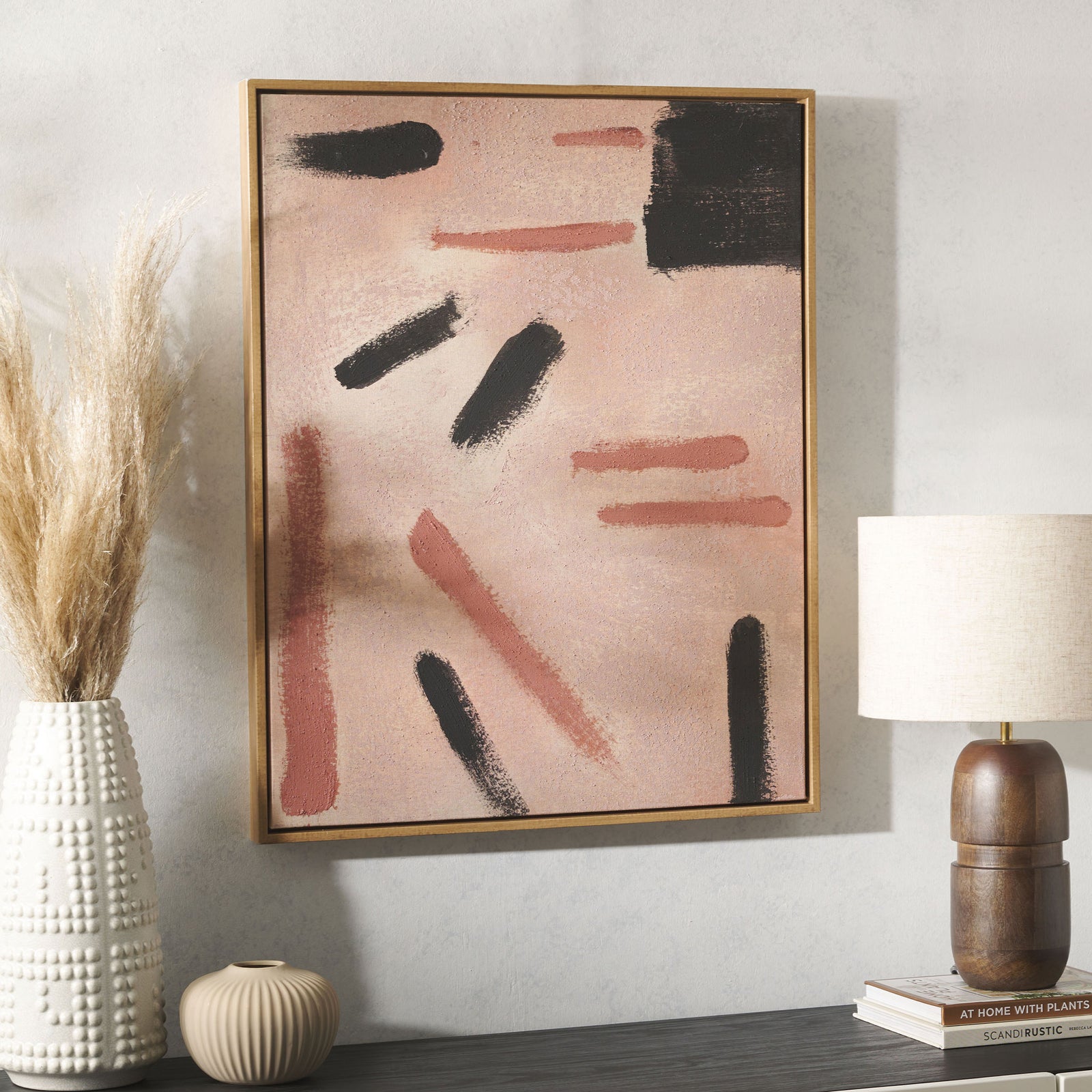 Warm peach and black abstract art in a slender wood-look frame complements neutral decor. || WLA2082A || front_room