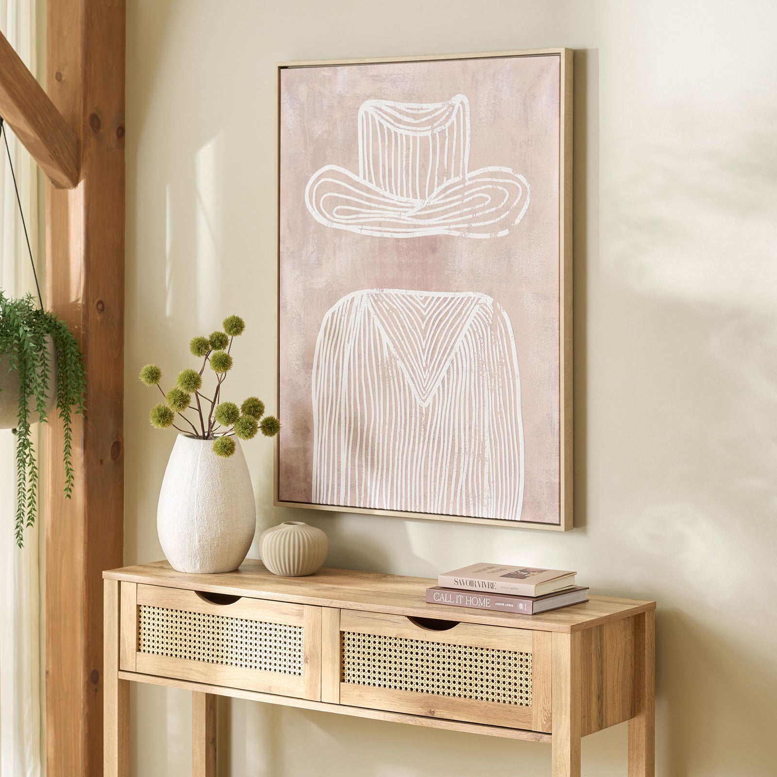 White Western-inspired linework on mauve canvas brings a gentle accent above a natural wood console. || WLA3041A || front_angle_room
